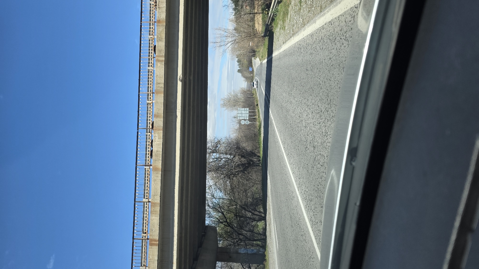 Vehicle drives under concrete overpass in Slatino, Bulgaria