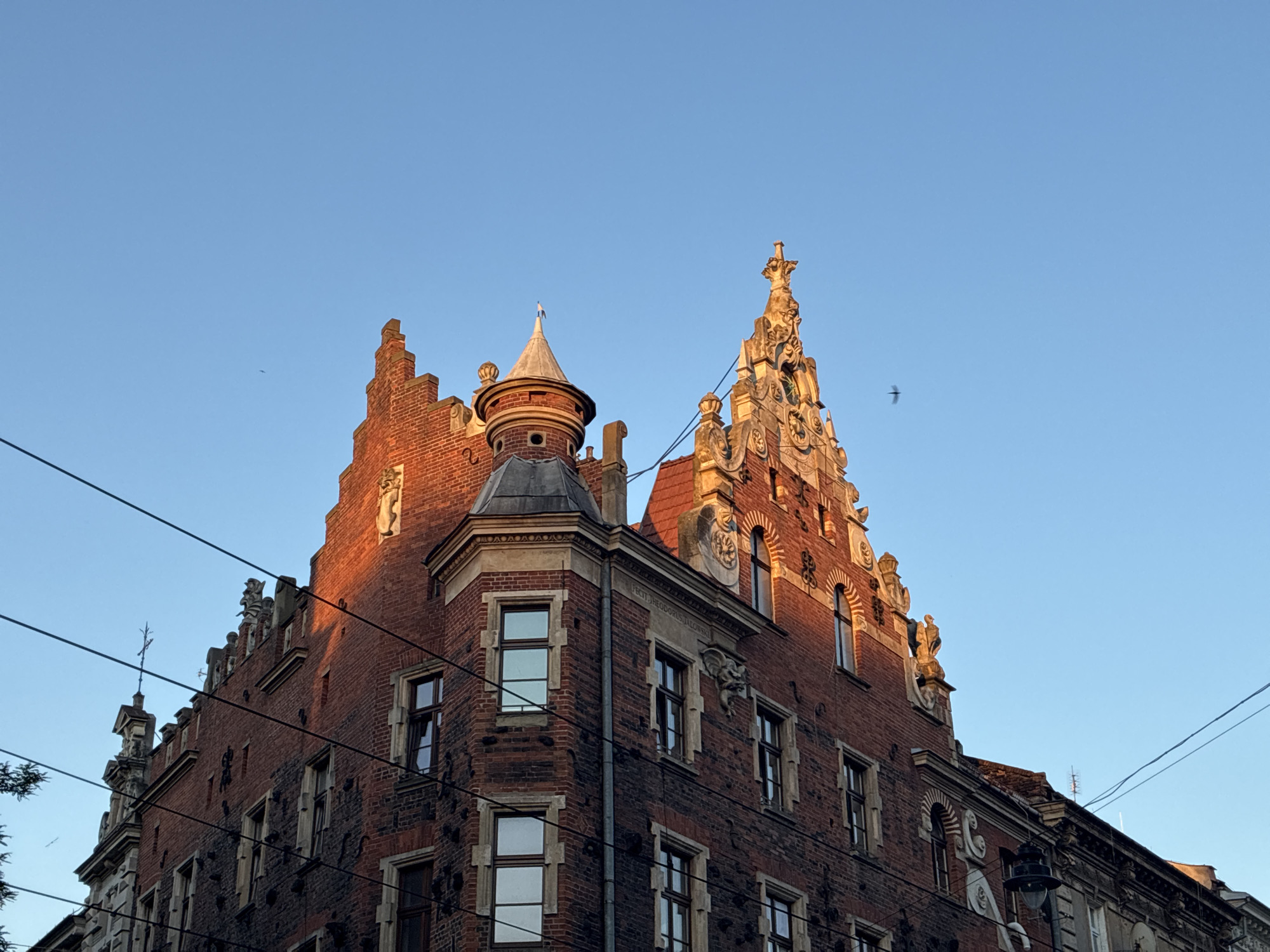 Kraków's historic façades and stone carvings at golden hour