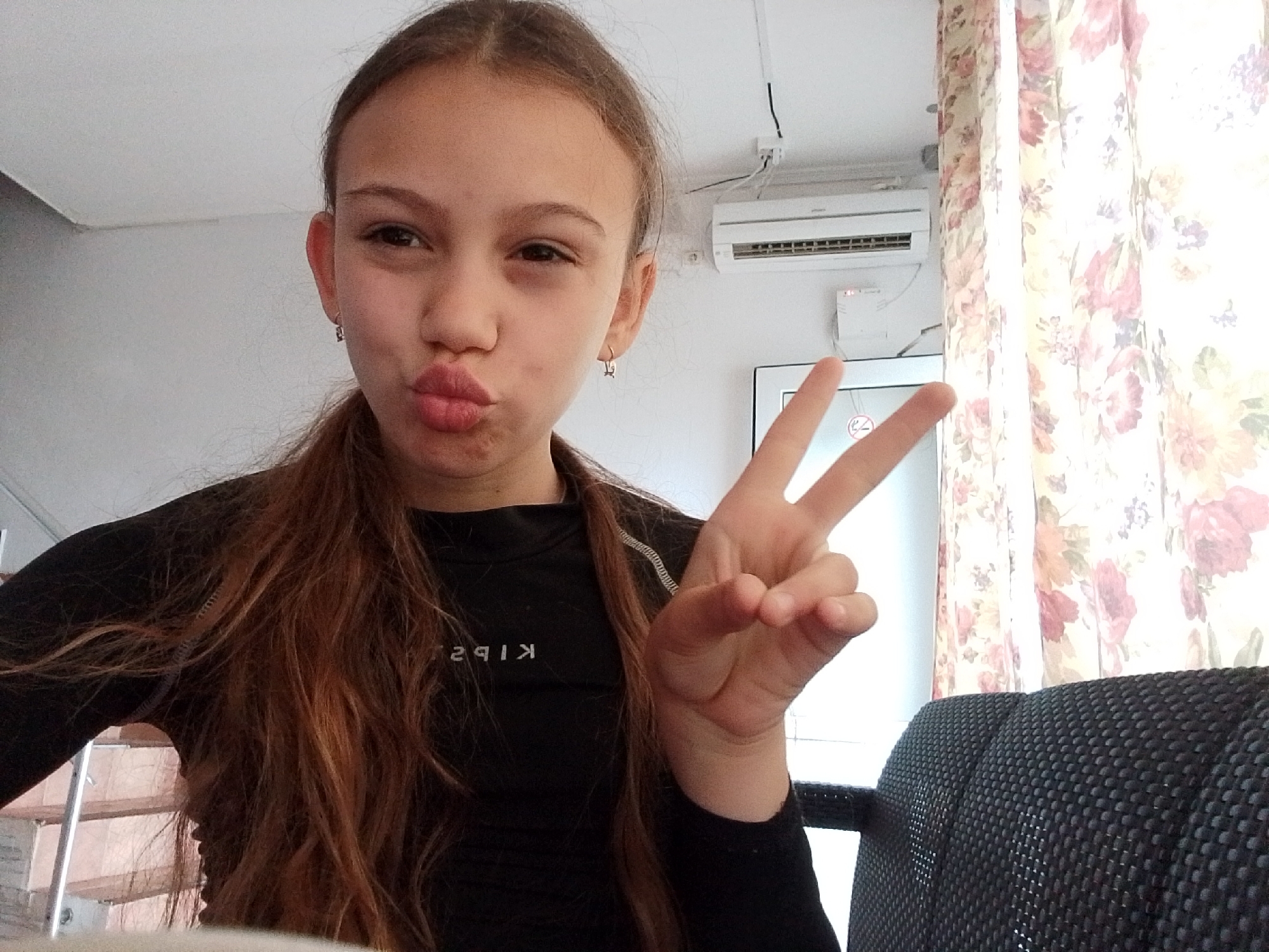 Young girl takes selfies in Sochi morning scene
