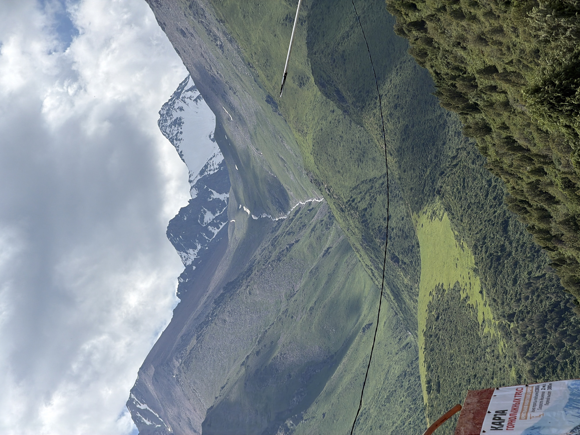 Kashka Suu ski resort in summer, lifts quiet and hills green