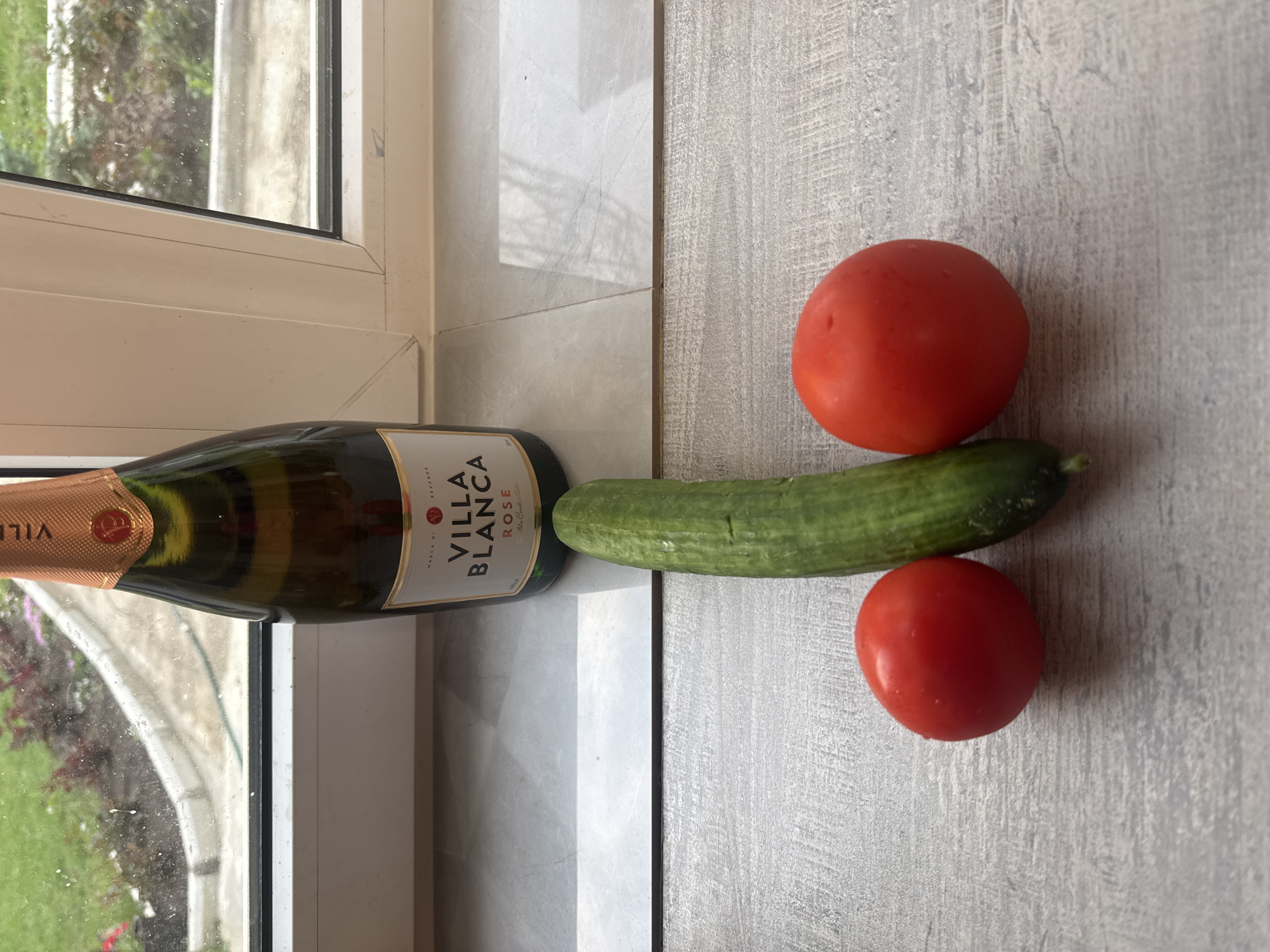 Woman photographed with wine and vegetables in Chaikovsky kitchen
