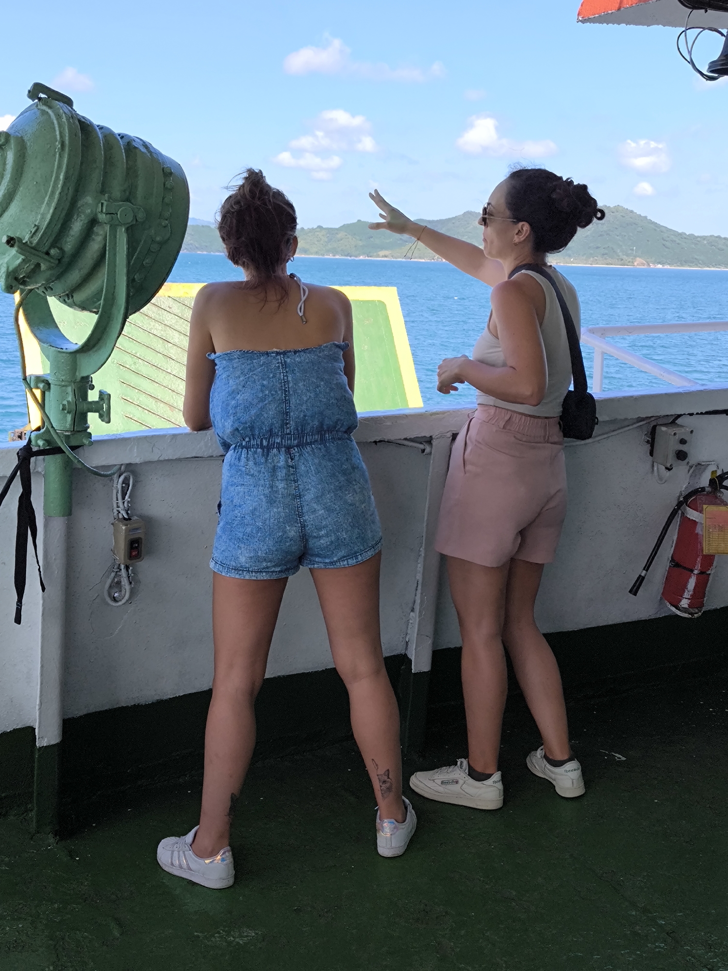 Ferry passengers travel between Indonesian islands in morning waters