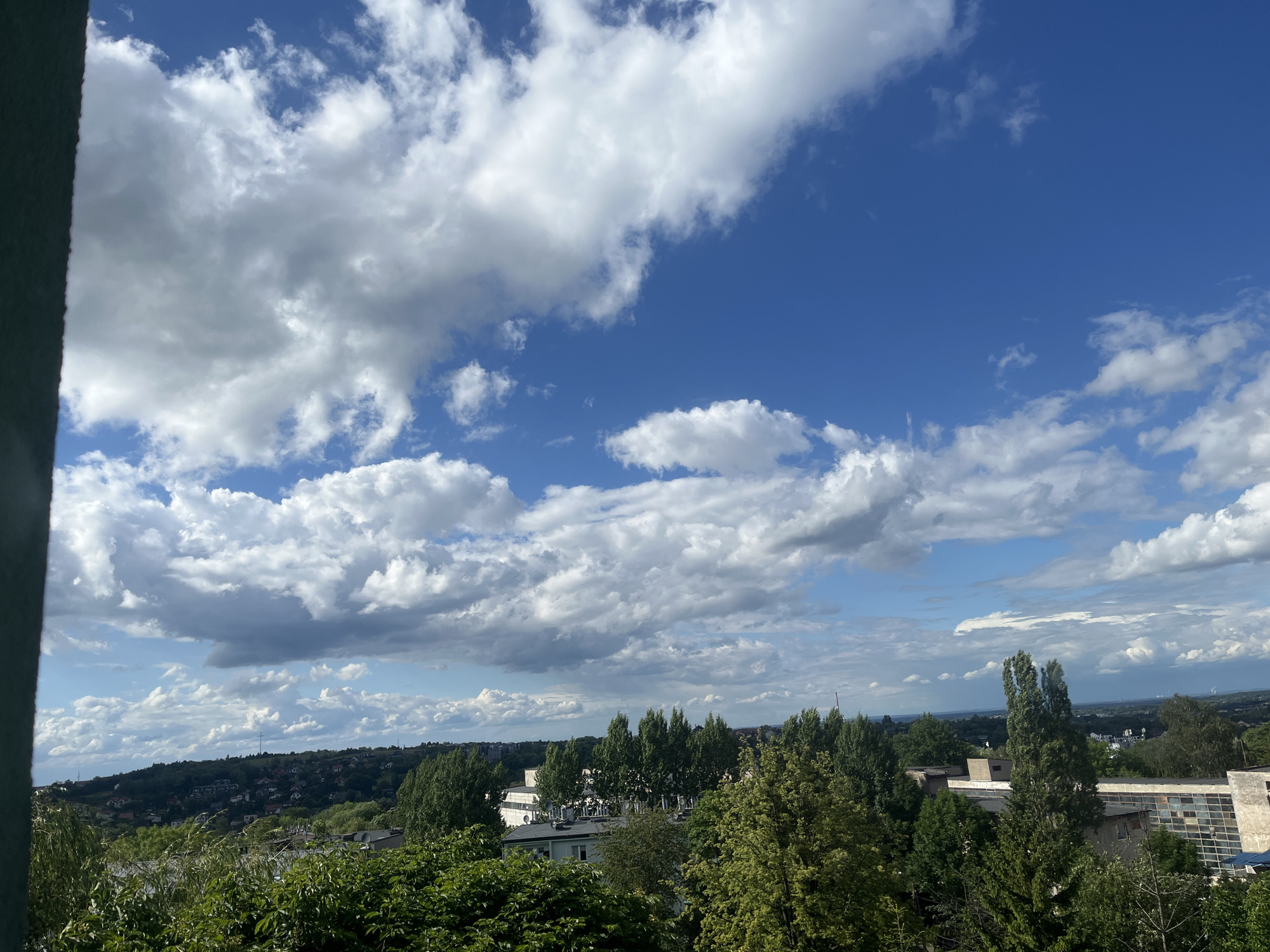 Afternoon sky-watching session with dramatic clouds over cityscape