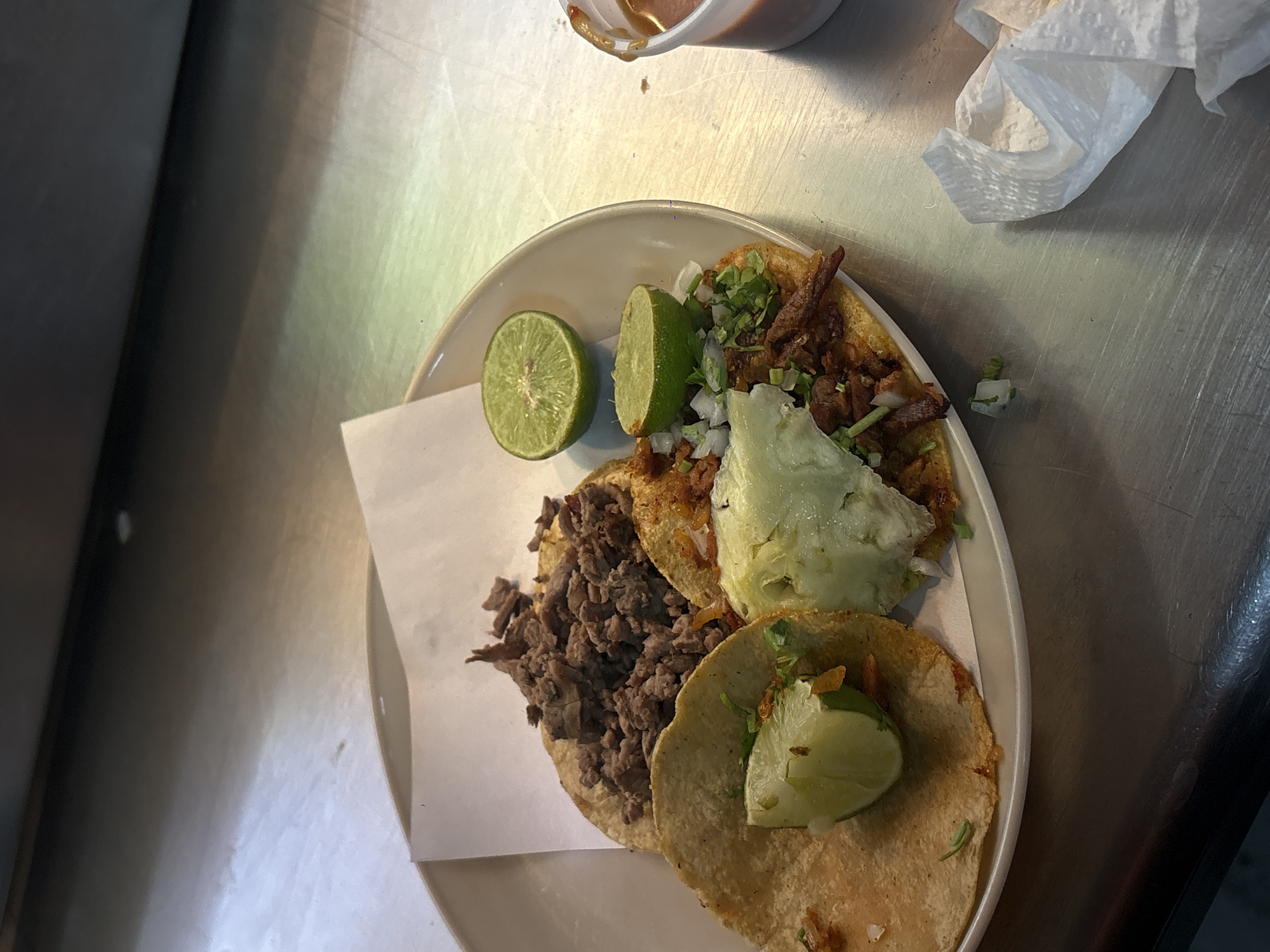 Three tacos with varied meat fillings spotted in Mexico City