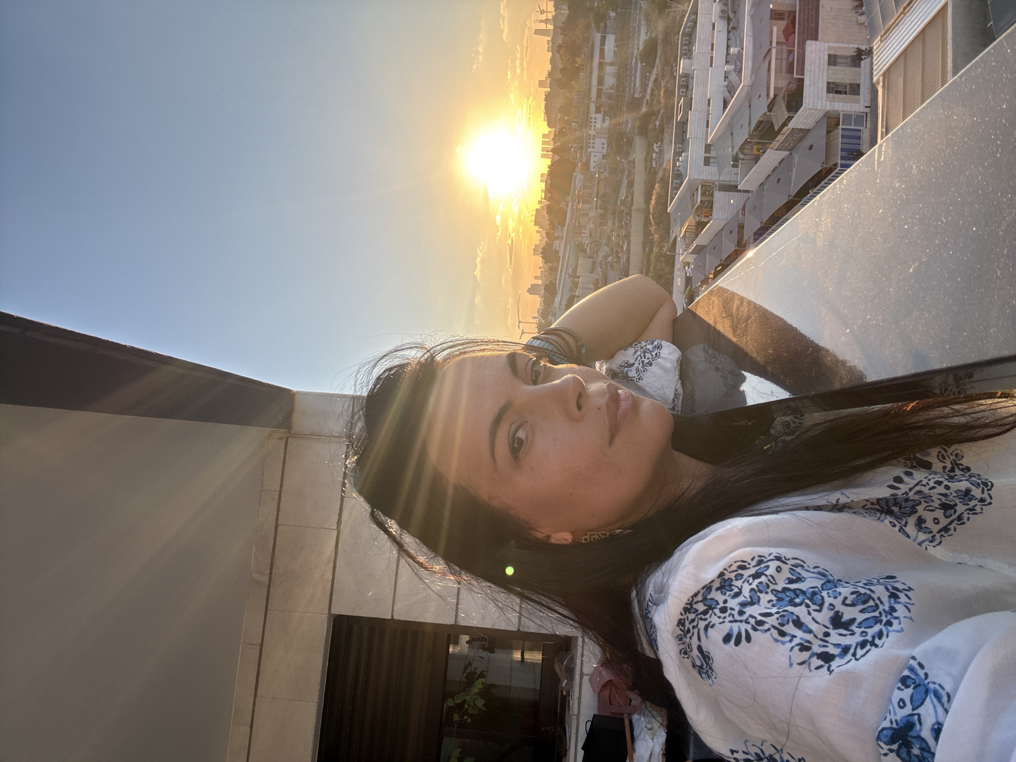Golden hour over Or Yehuda rooftops, July evening