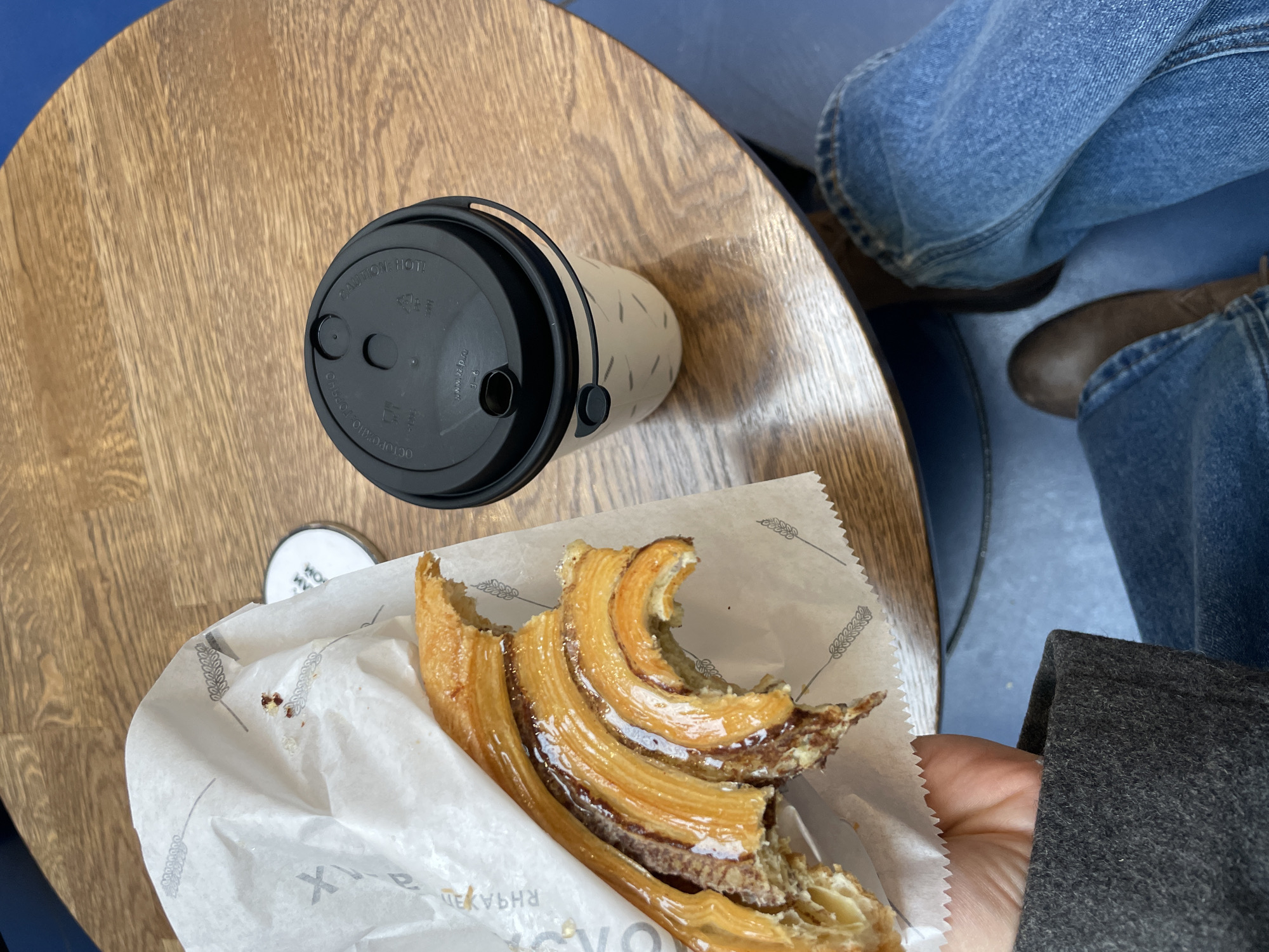 Person enjoys pastry indoors in Moscow