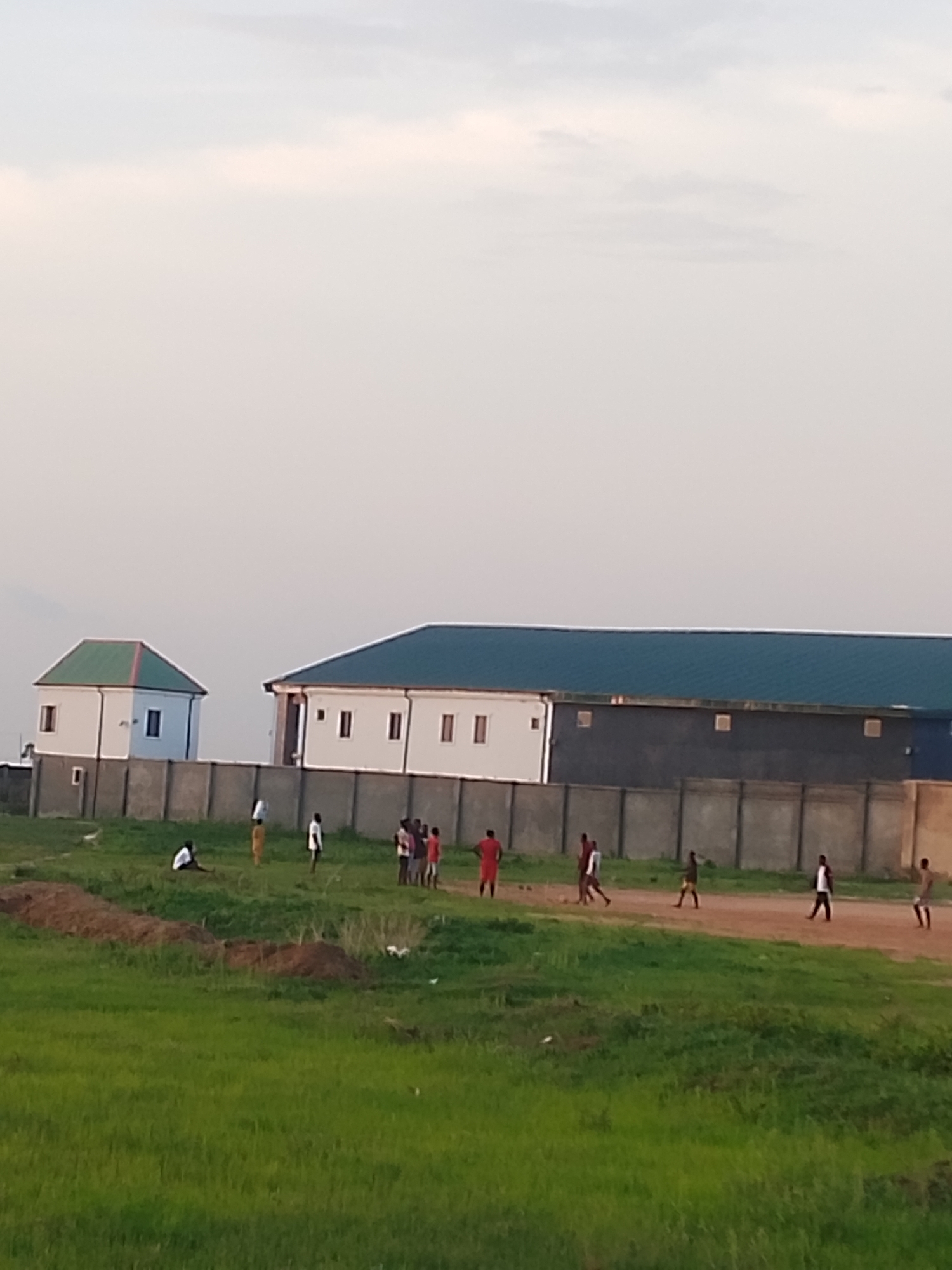 Rural Nigeria communities captured in evening field gatherings