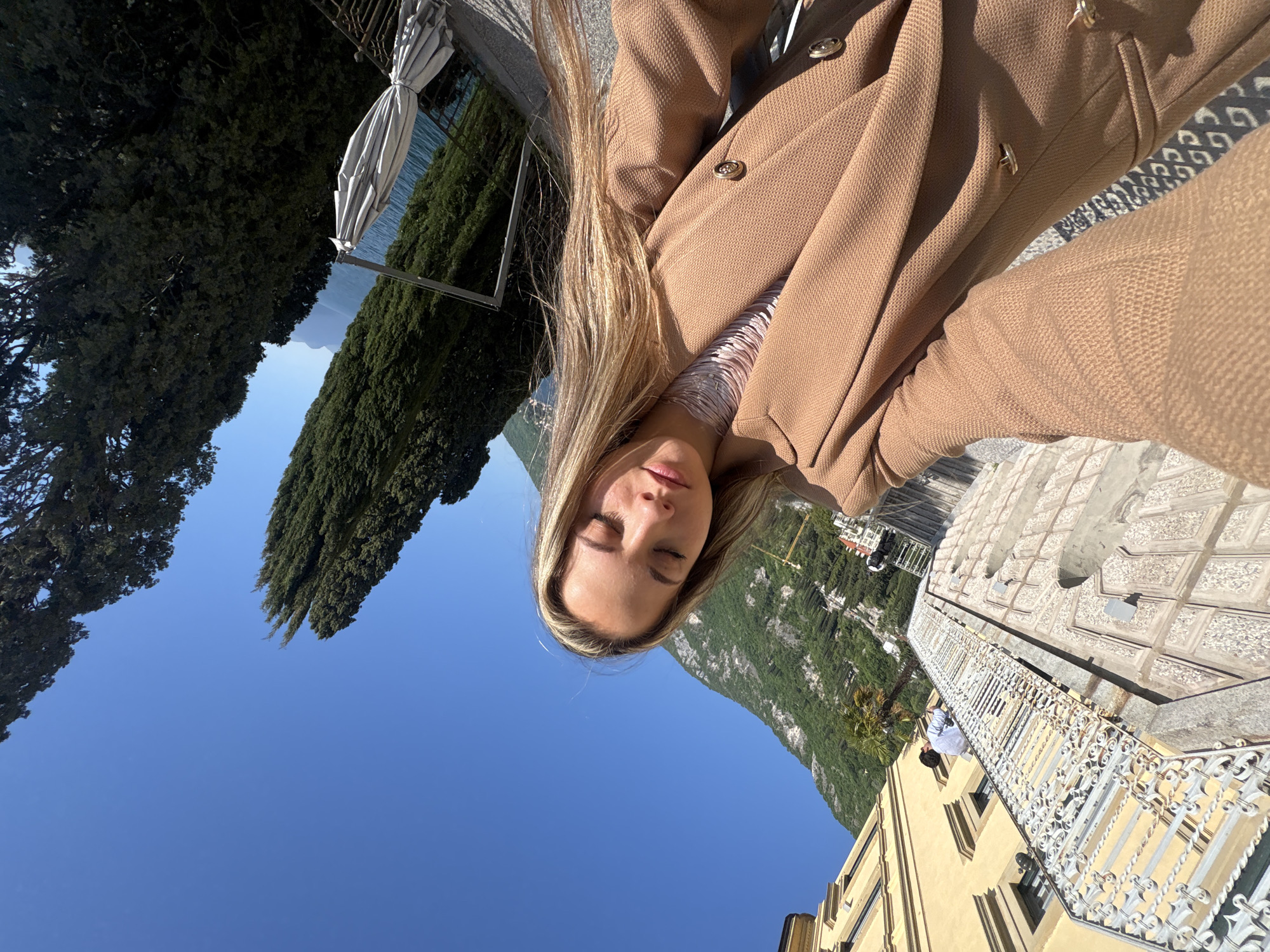 Tourist captures selfie moment at Lake Como scenic overlook