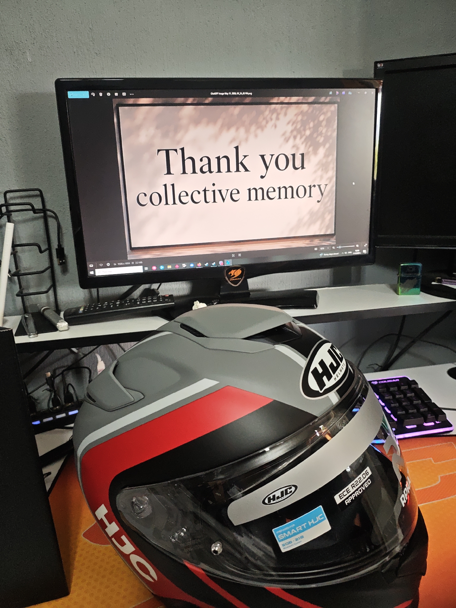 Computer displays collective memory thank you message with helmet