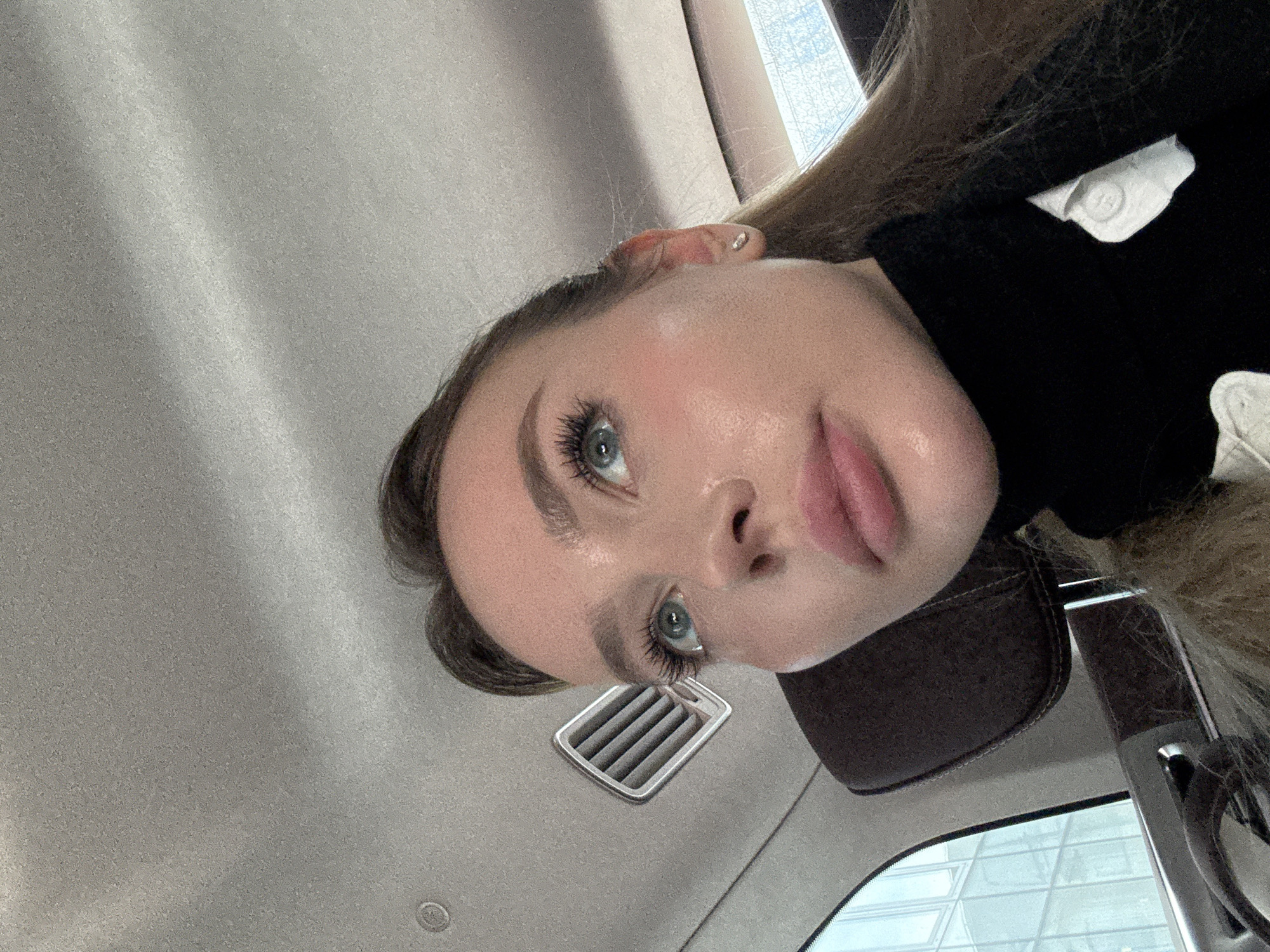 Woman takes selfie in car in Moscow