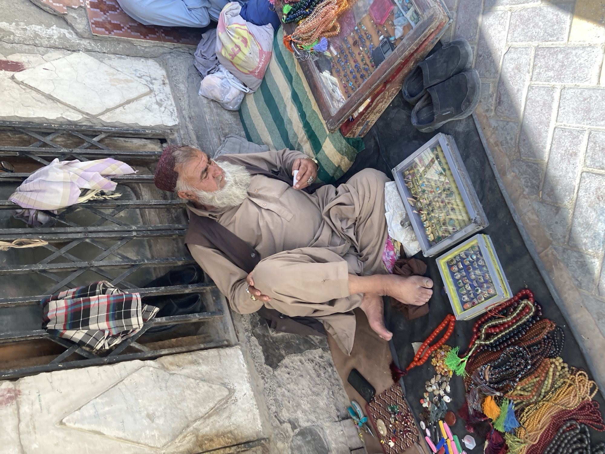 Street vendors sell jewelry and trinkets in Quetta