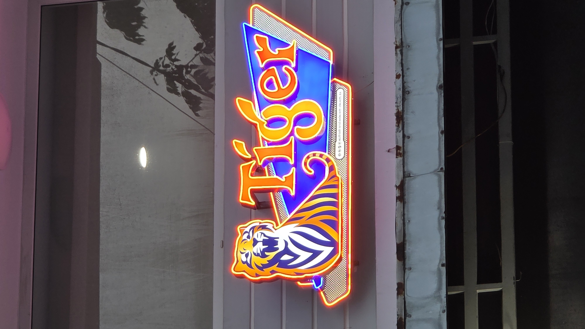 Neon signs and colorful lanterns illuminate Nha Trang streets