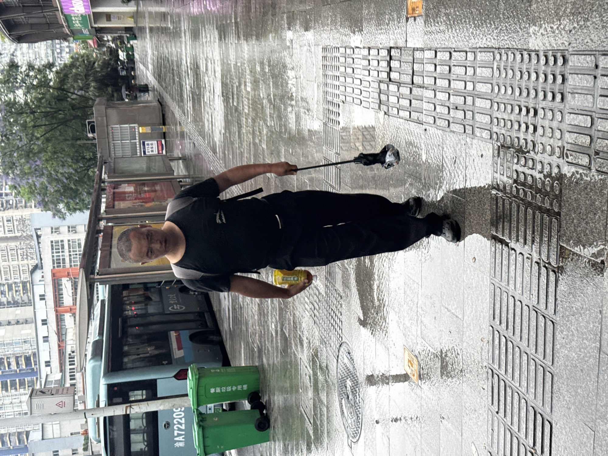 Rainy evening brings umbrellas and wet streets to Longta