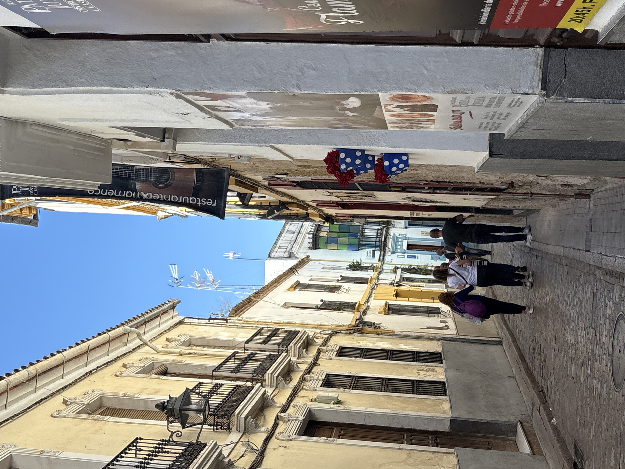Morning foot traffic on decorative street in Córdoba, Spain