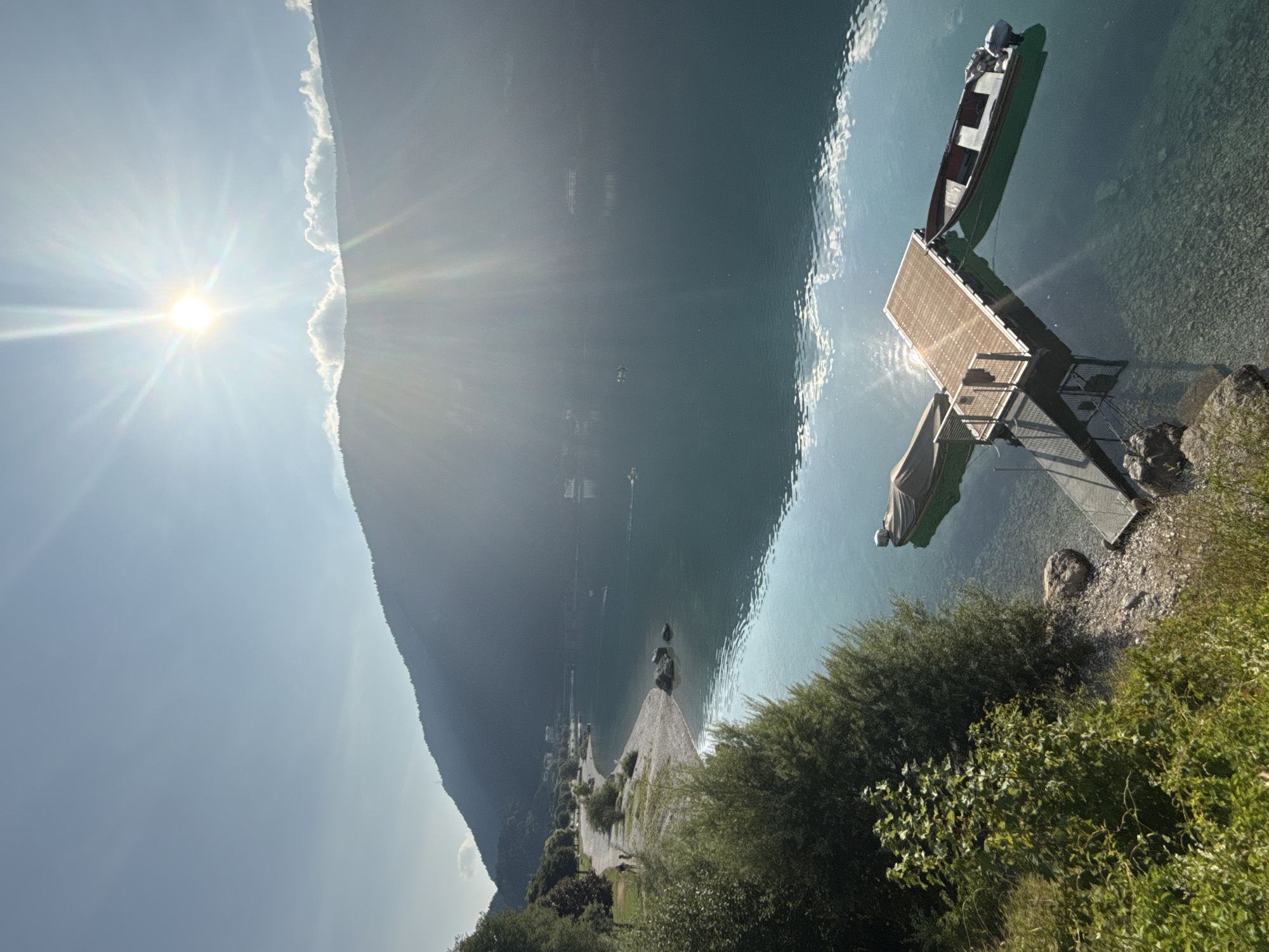 Morning at Lake Molveno: clear water, mountain views, lakeside activity