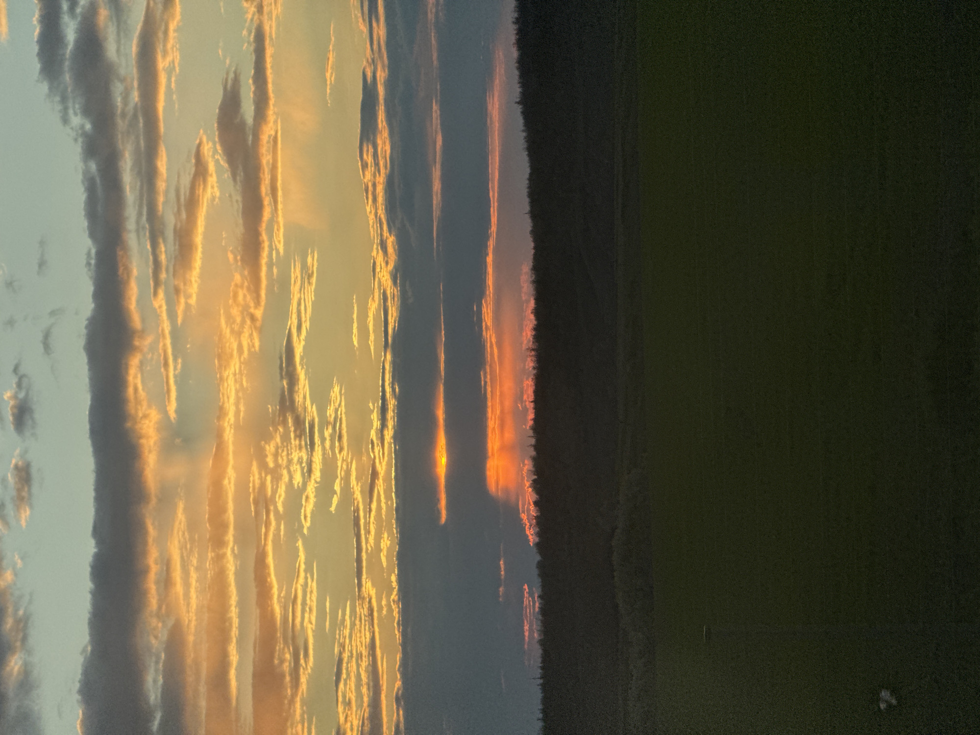 Dramatic sunset captured over rural Krasnaya Zarya, Russia