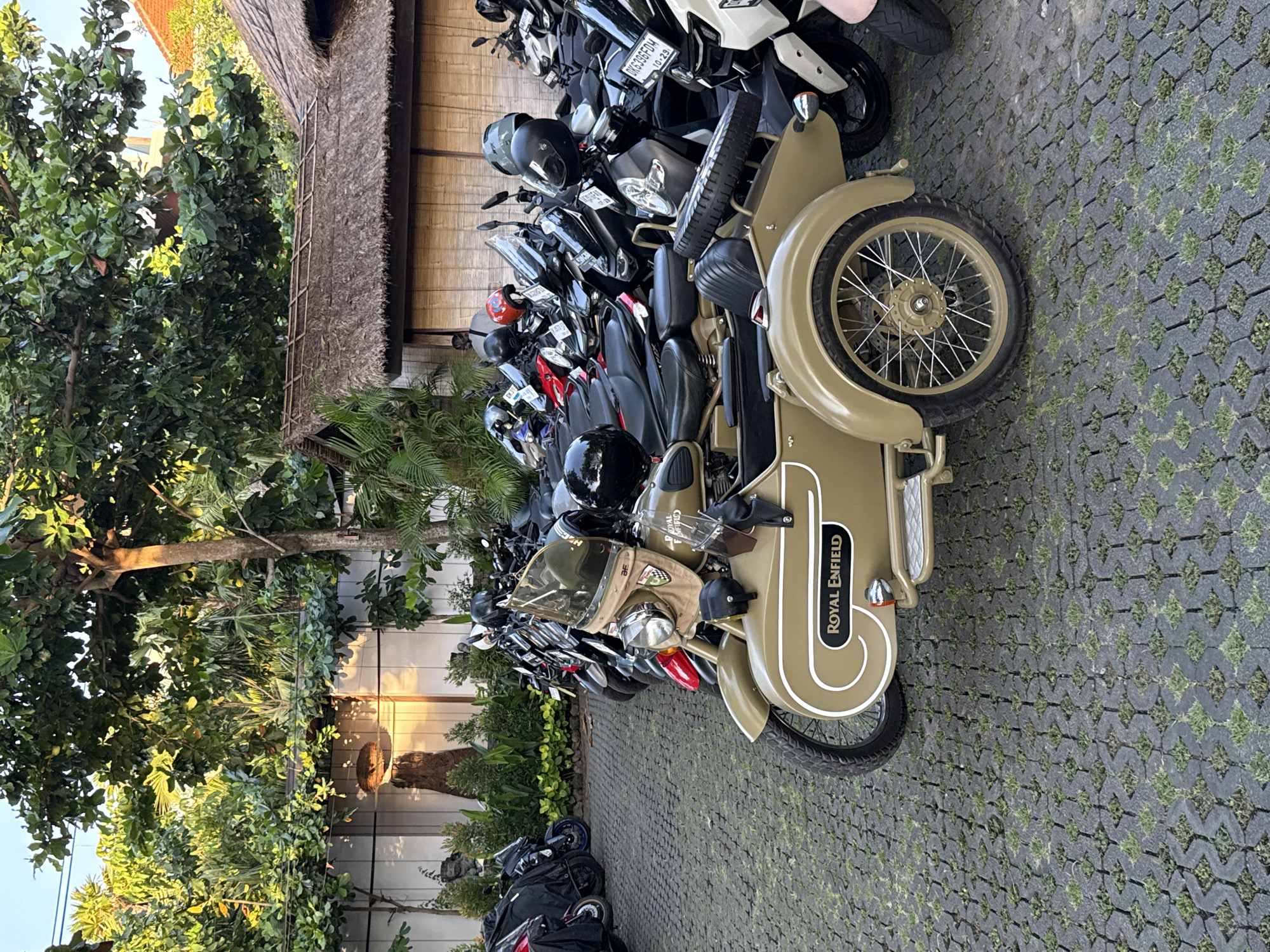 Vehicles parked at Kuta Selatan resort during golden hour