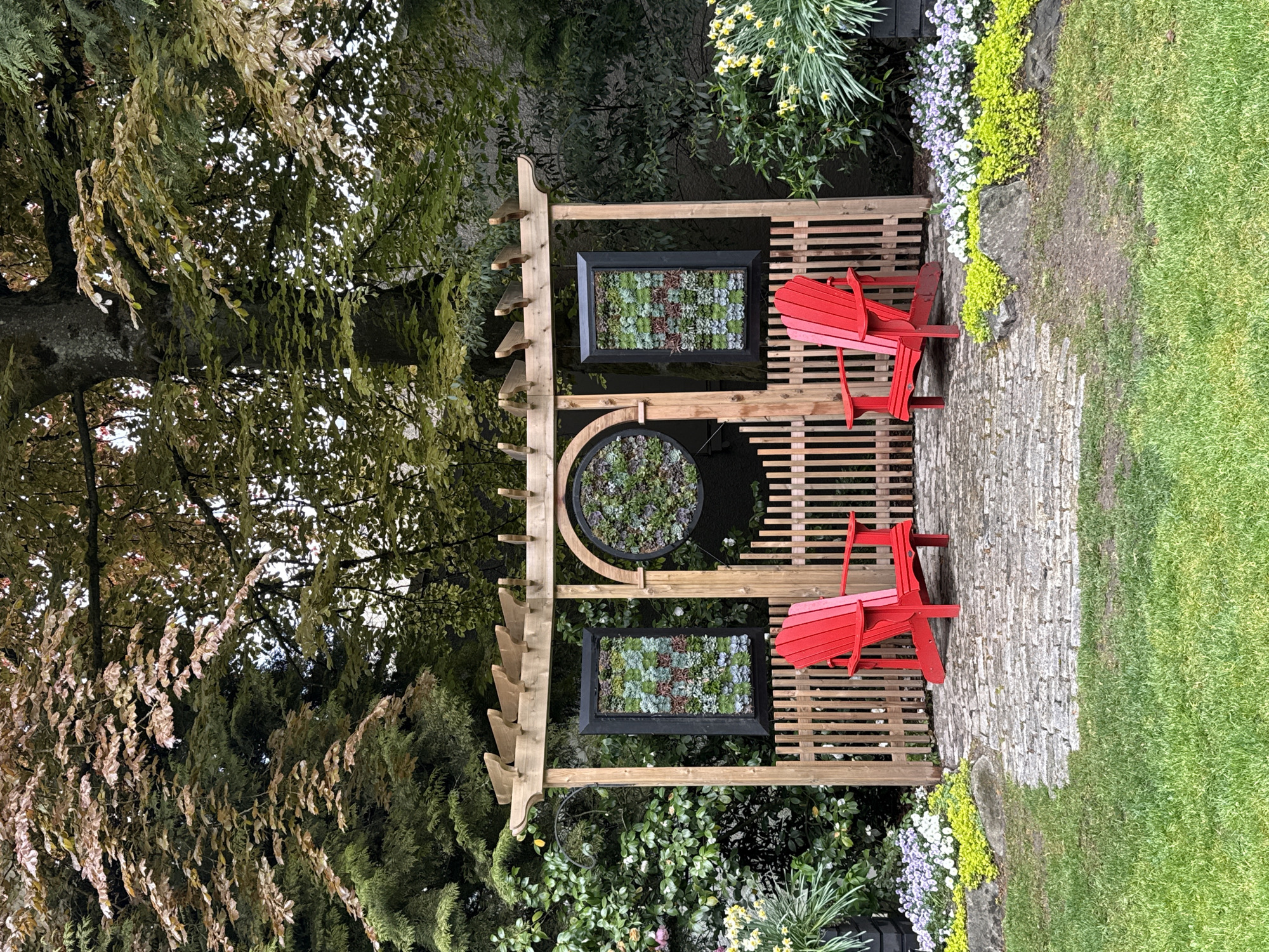 Garden documentation captures pergola, flowers, totem pole in New Westminster