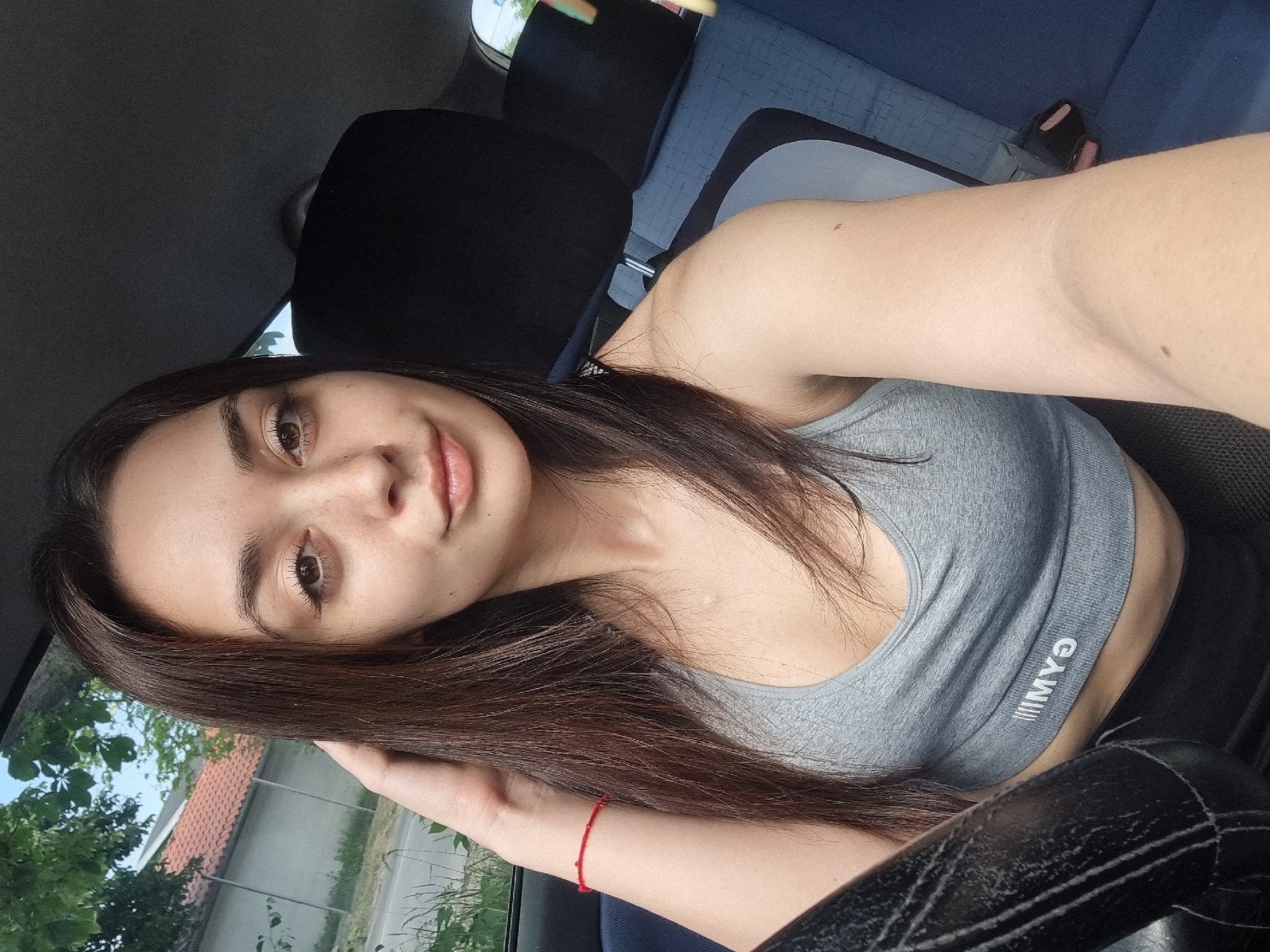 Woman takes morning selfies in car in Sofia