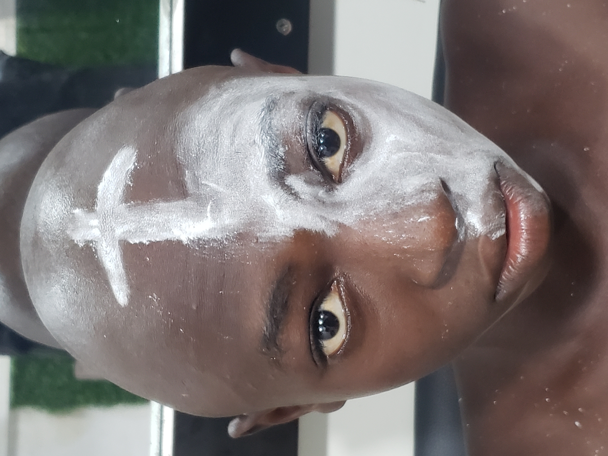 Ceremonial face painting documented in Adankolo, Nigeria at sunset