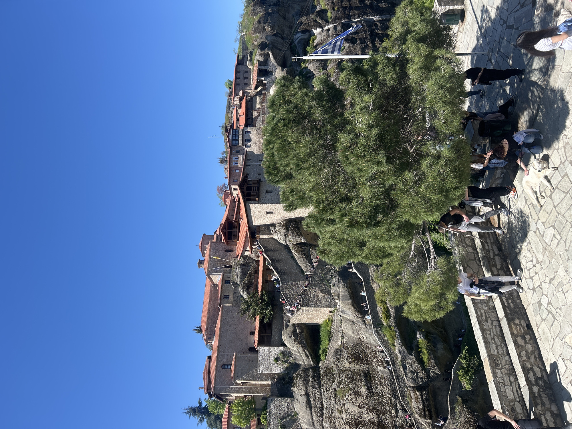 Tourists photograph themselves at Meteora monastery complex in Greece