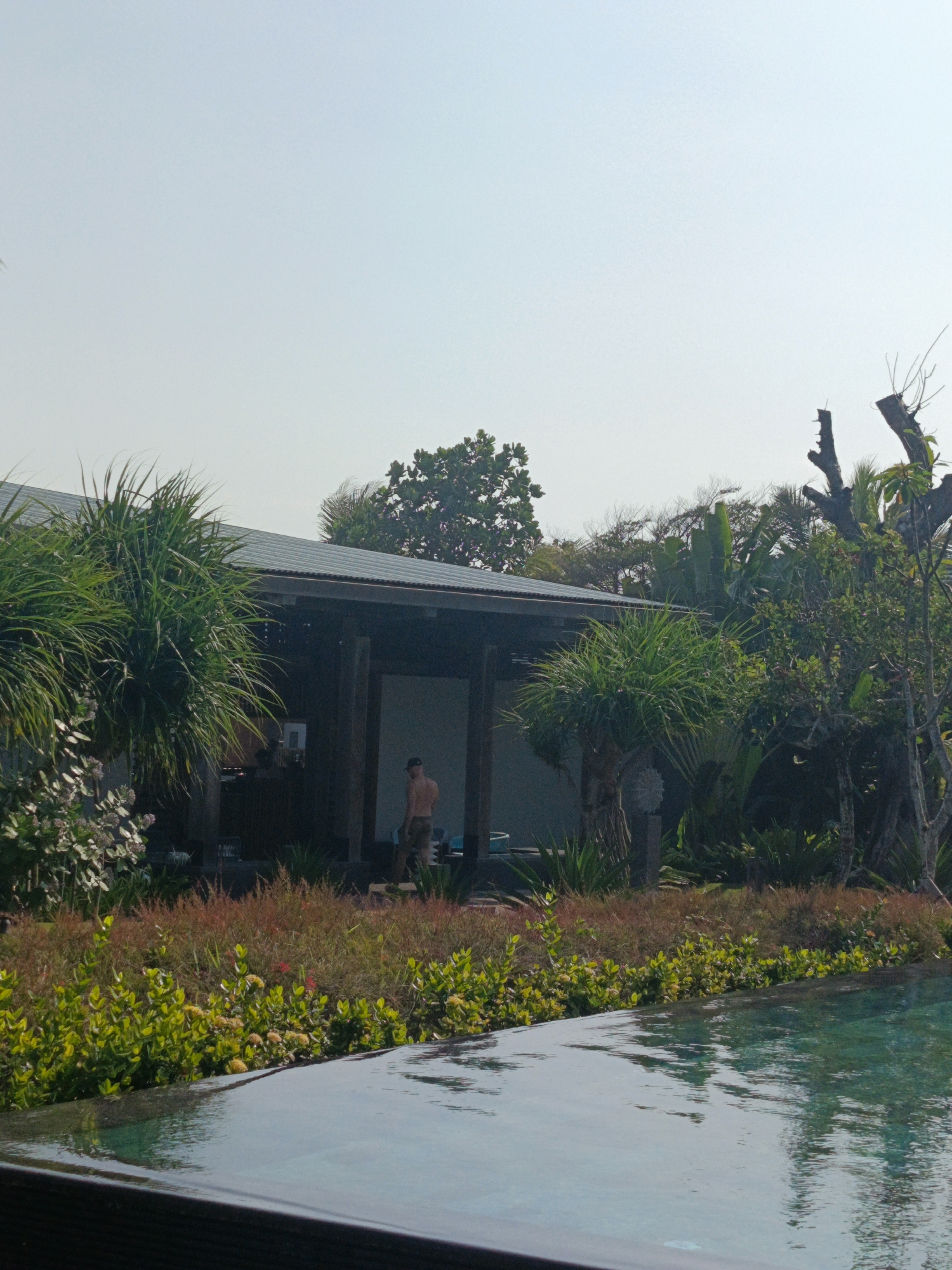 Beach day scenes along North Kuta's black sand shore