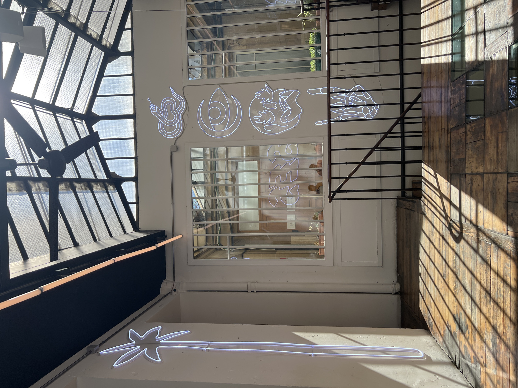 Sunlight through a glass ceiling in a Paris café
