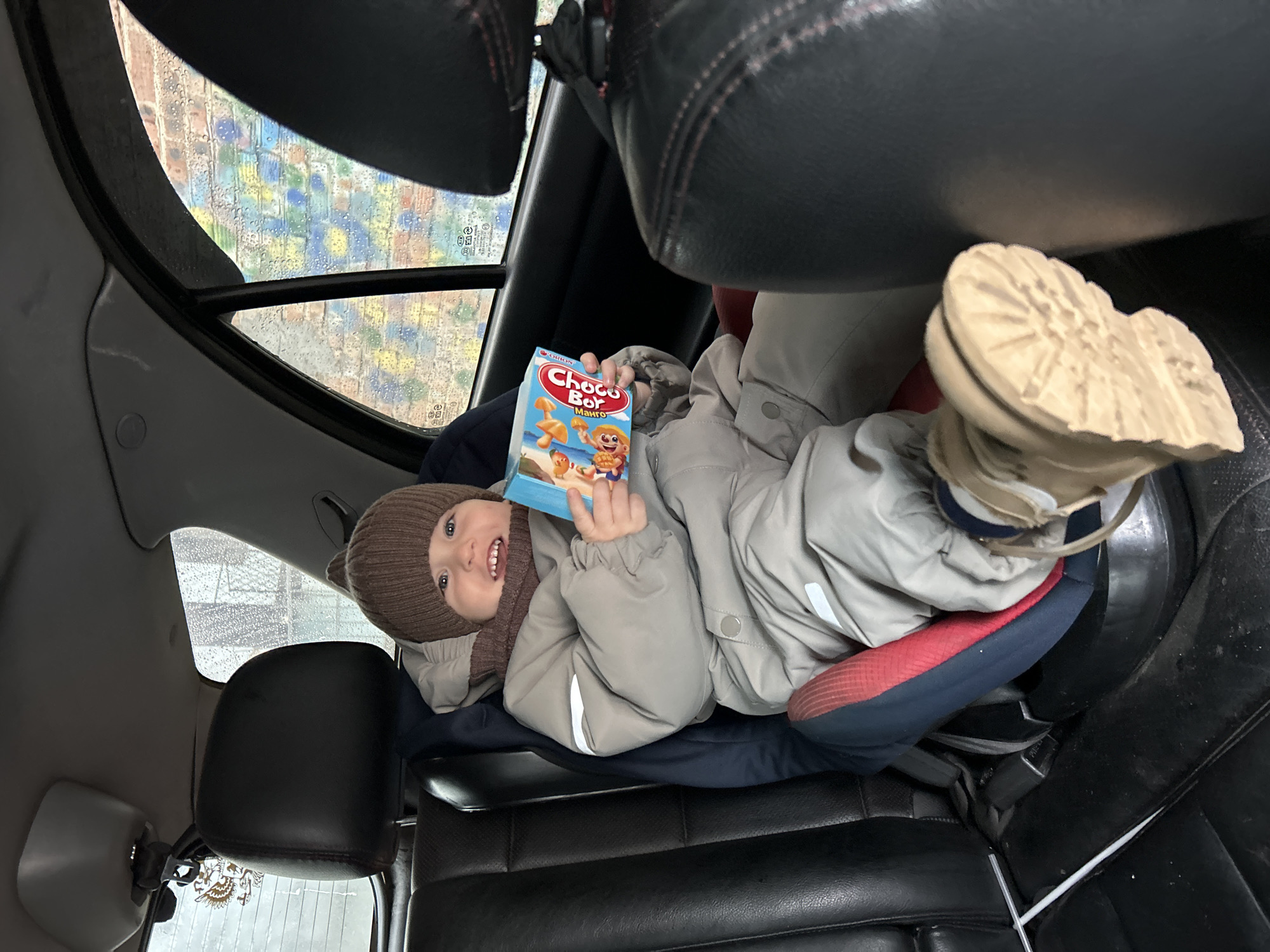 Family with child spotted during rainy day in Klin
