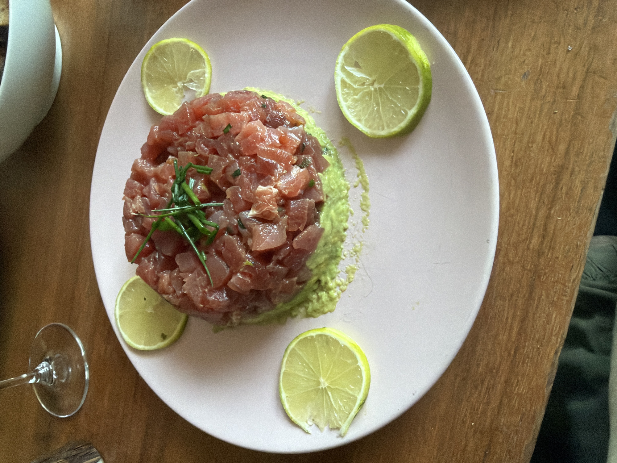 Diner enjoys tuna tartare meal at candlelit London restaurant
