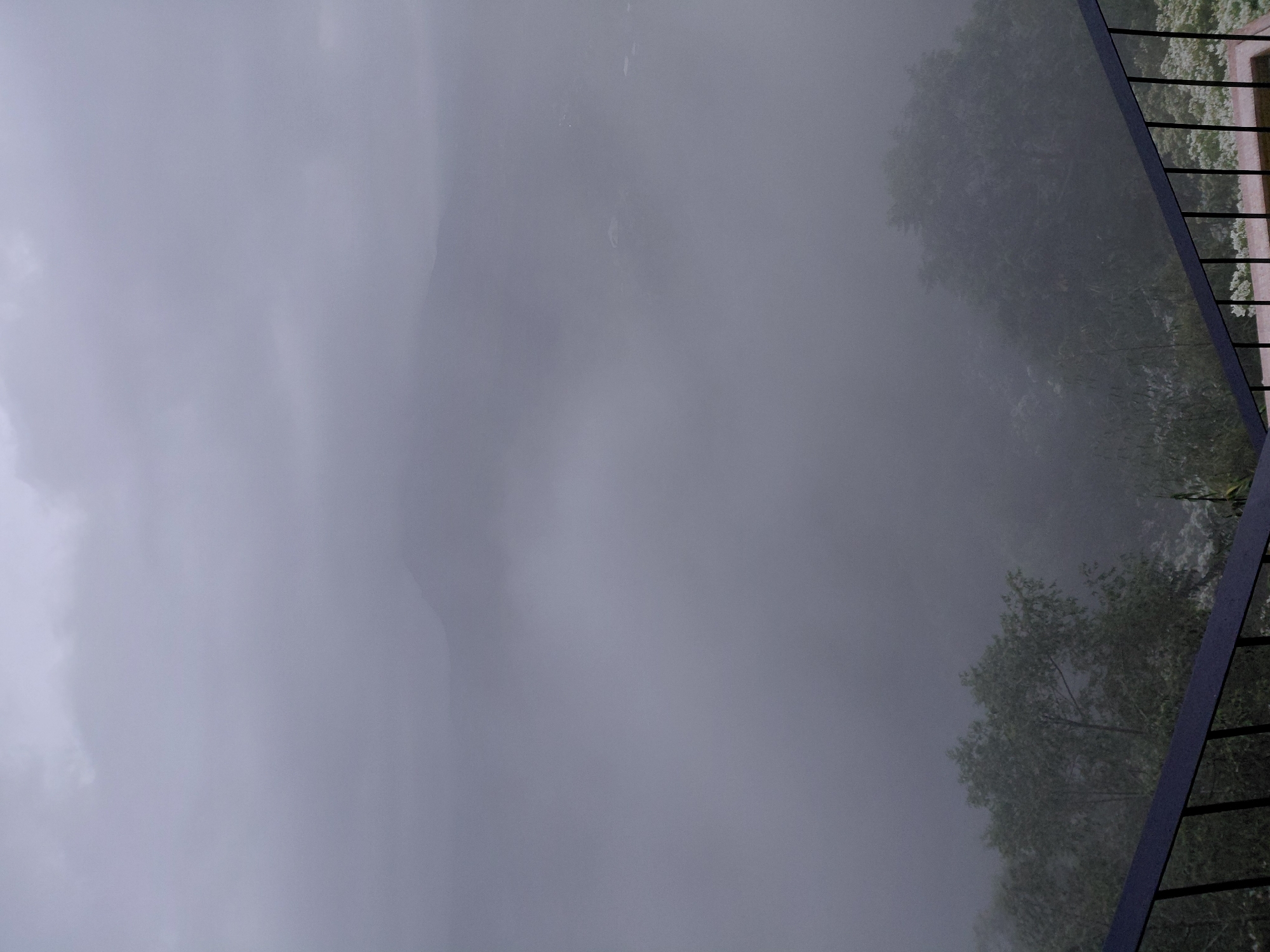 Foggy hillside café stop with rustic interiors and a drone overhead