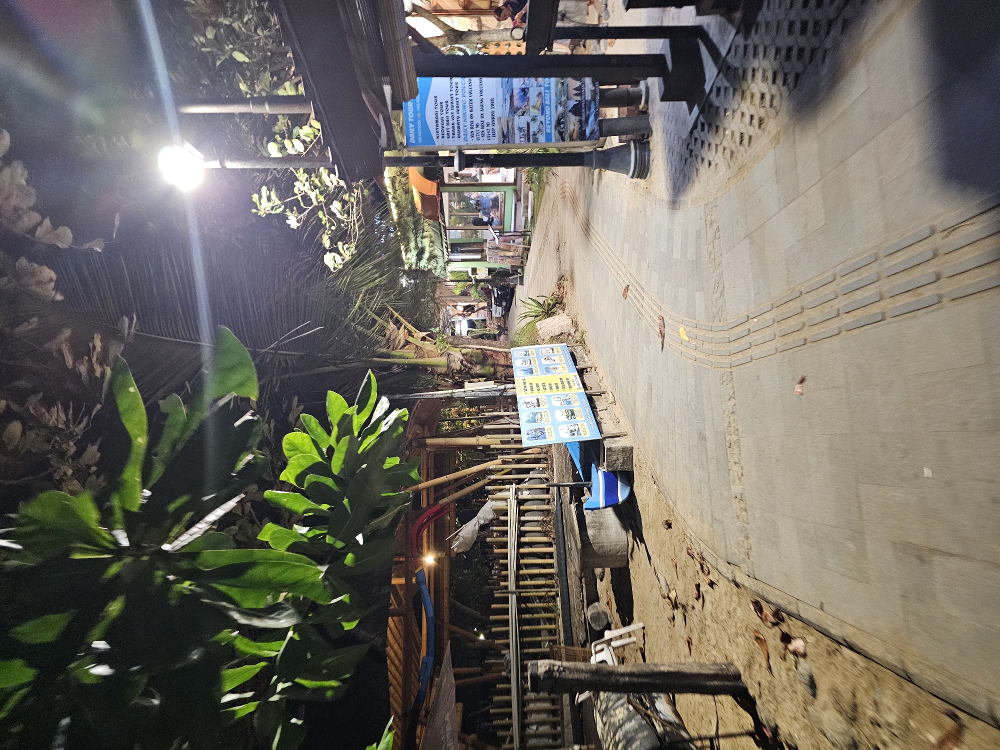 Nighttime scenes around a Denpasar venue strip