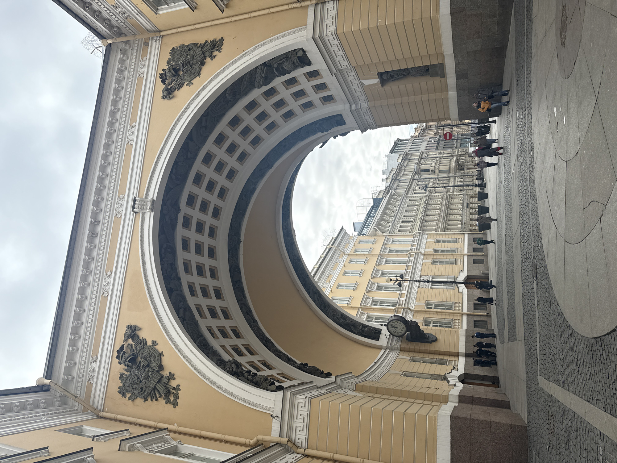 Witness captures grand cream-colored archway from street level