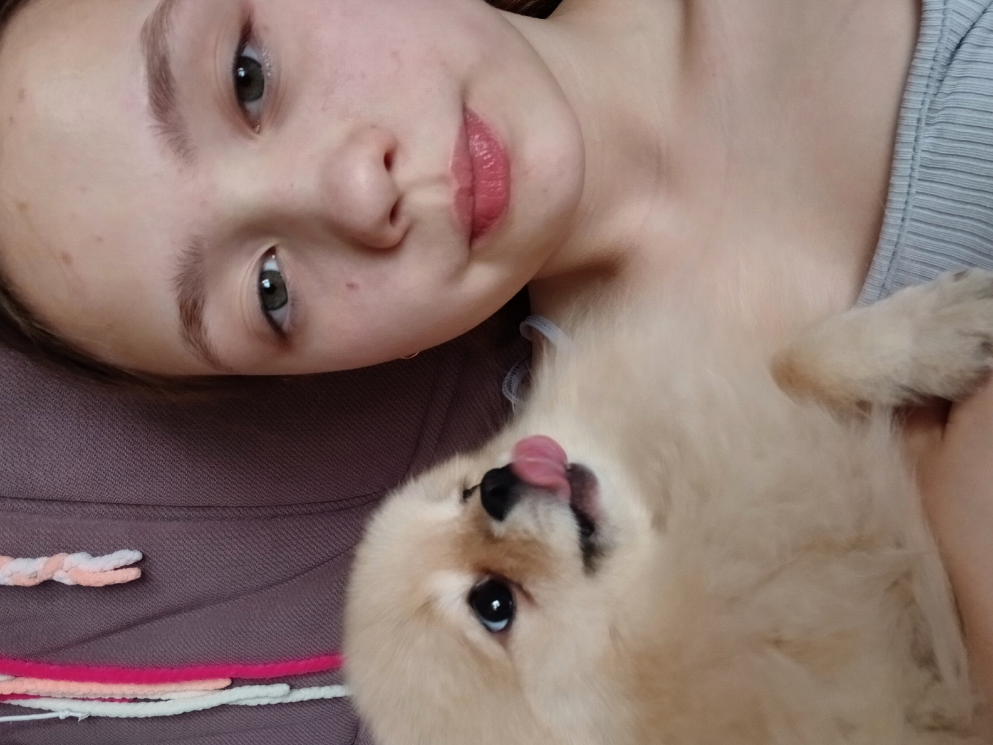Woman and Pomeranian dog captured in casual moments, Krasnodar