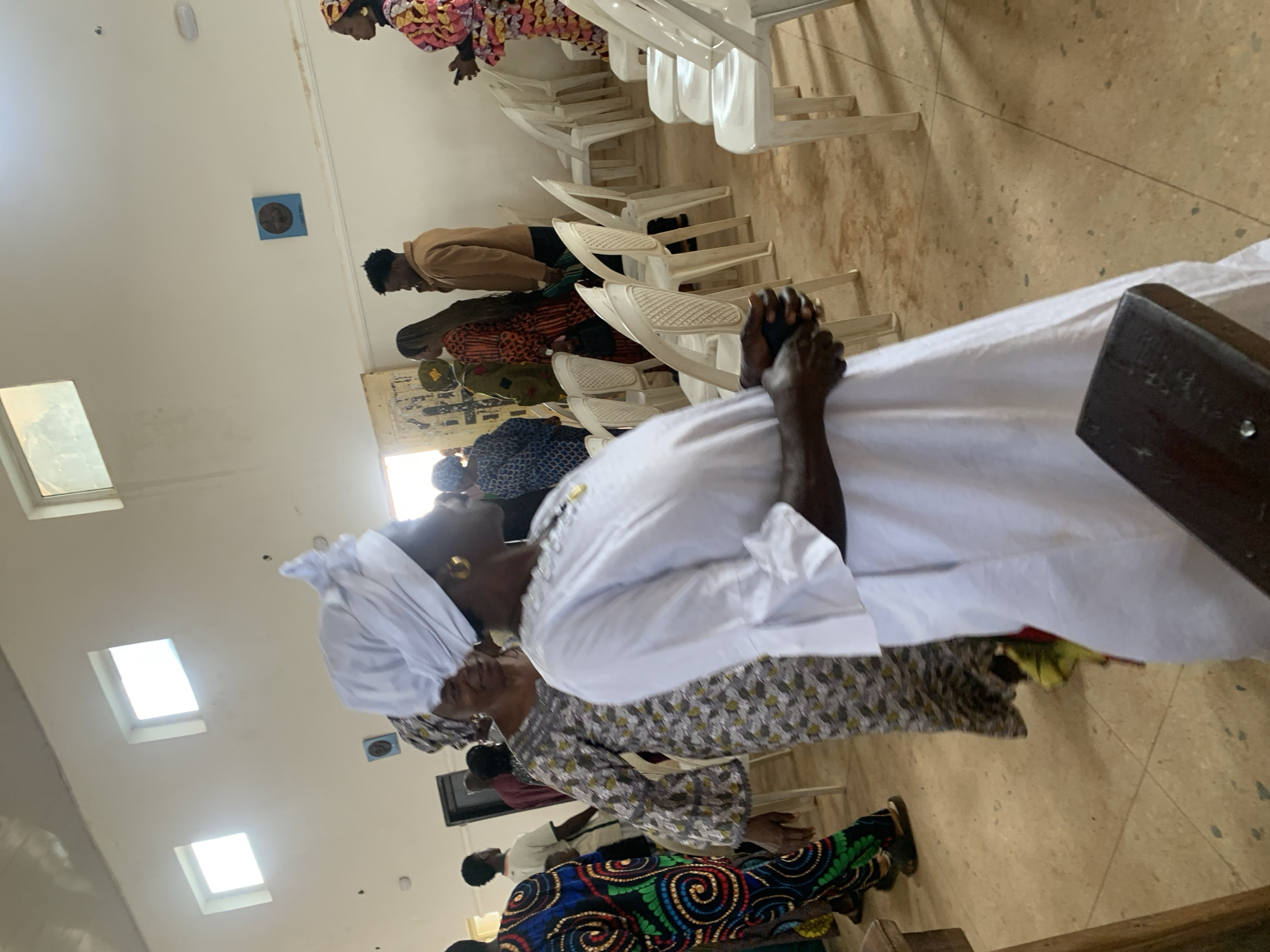 Community religious gathering in Jos, Nigeria, in traditional dress