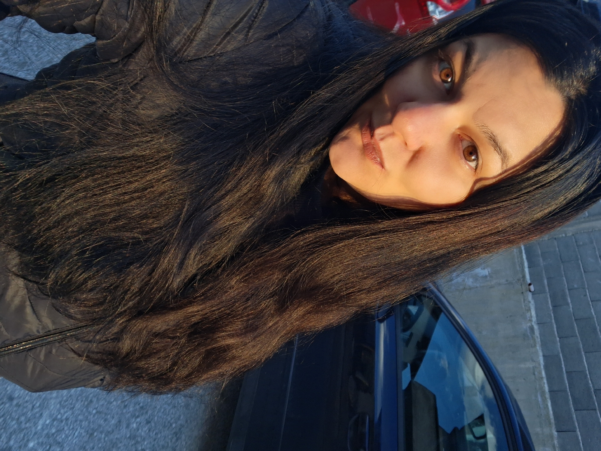 Woman observed on sunset street in Goce Delcev, Bulgaria