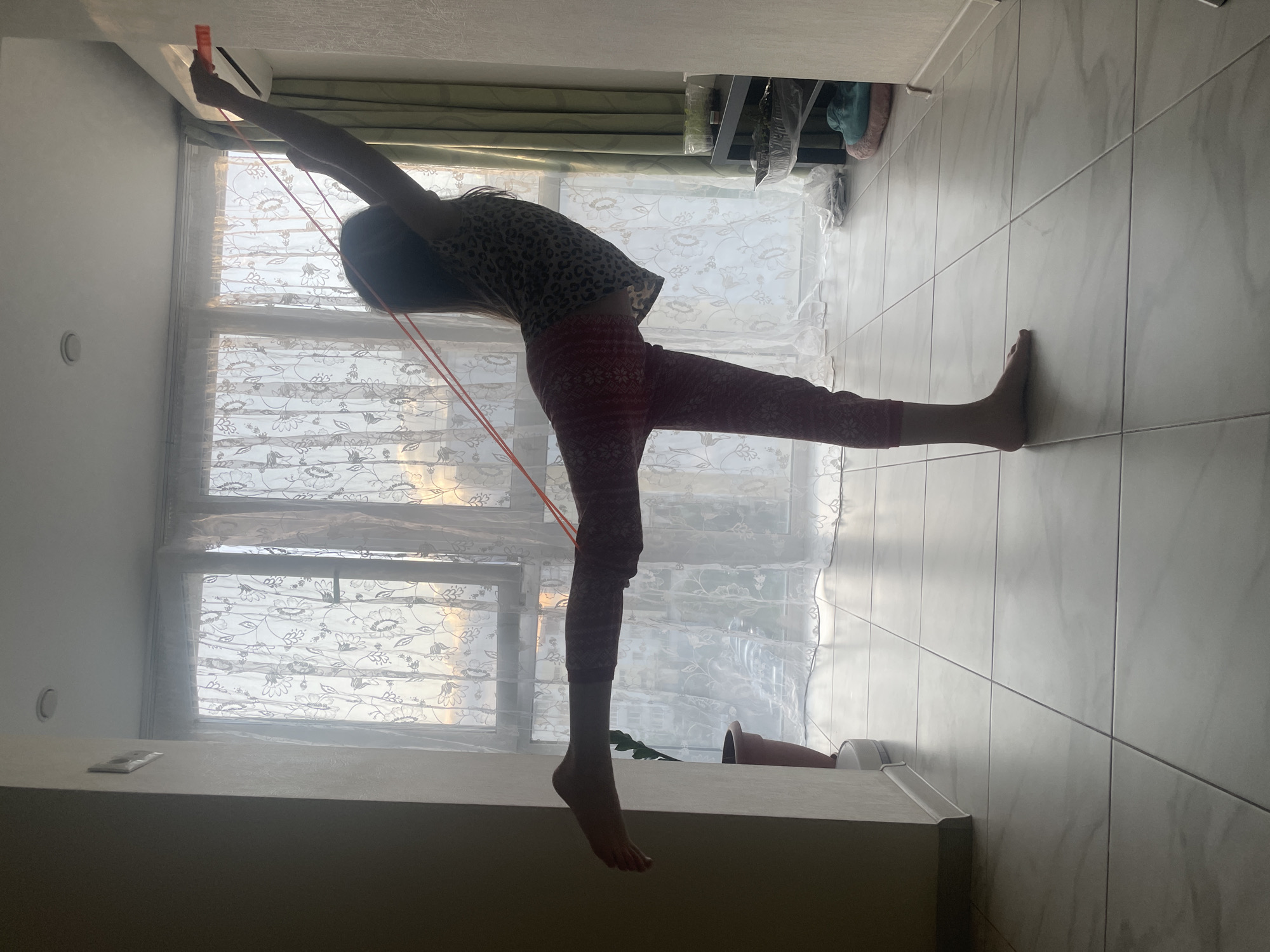 Young person exercises with yoga and jump rope in Saratov