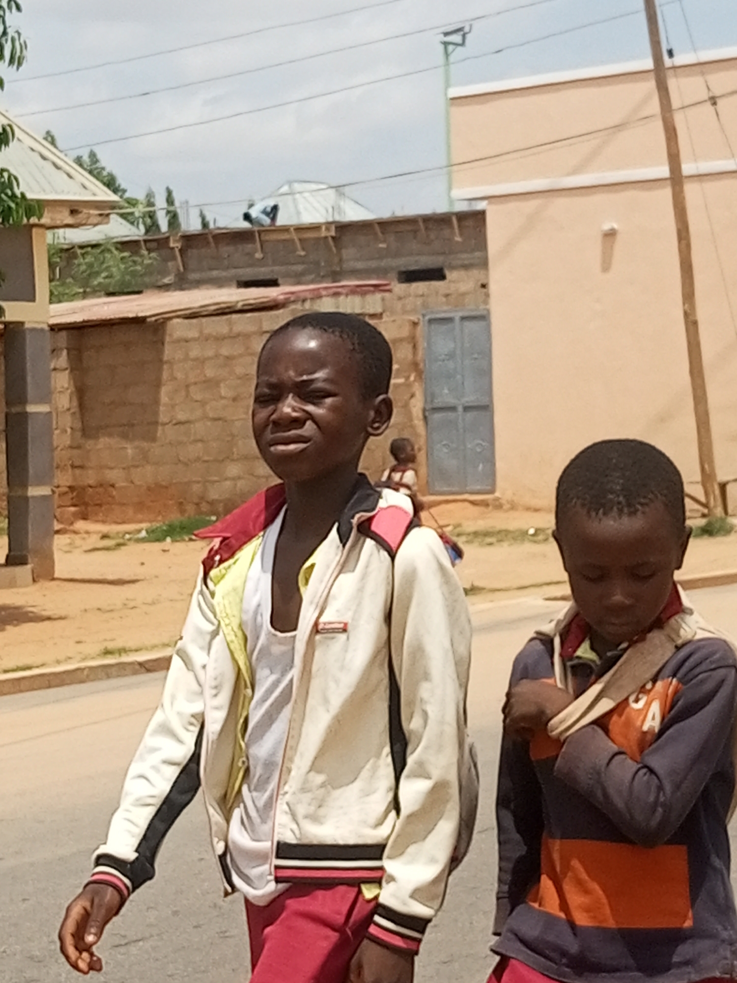 Midday street life across two Nigerian towns