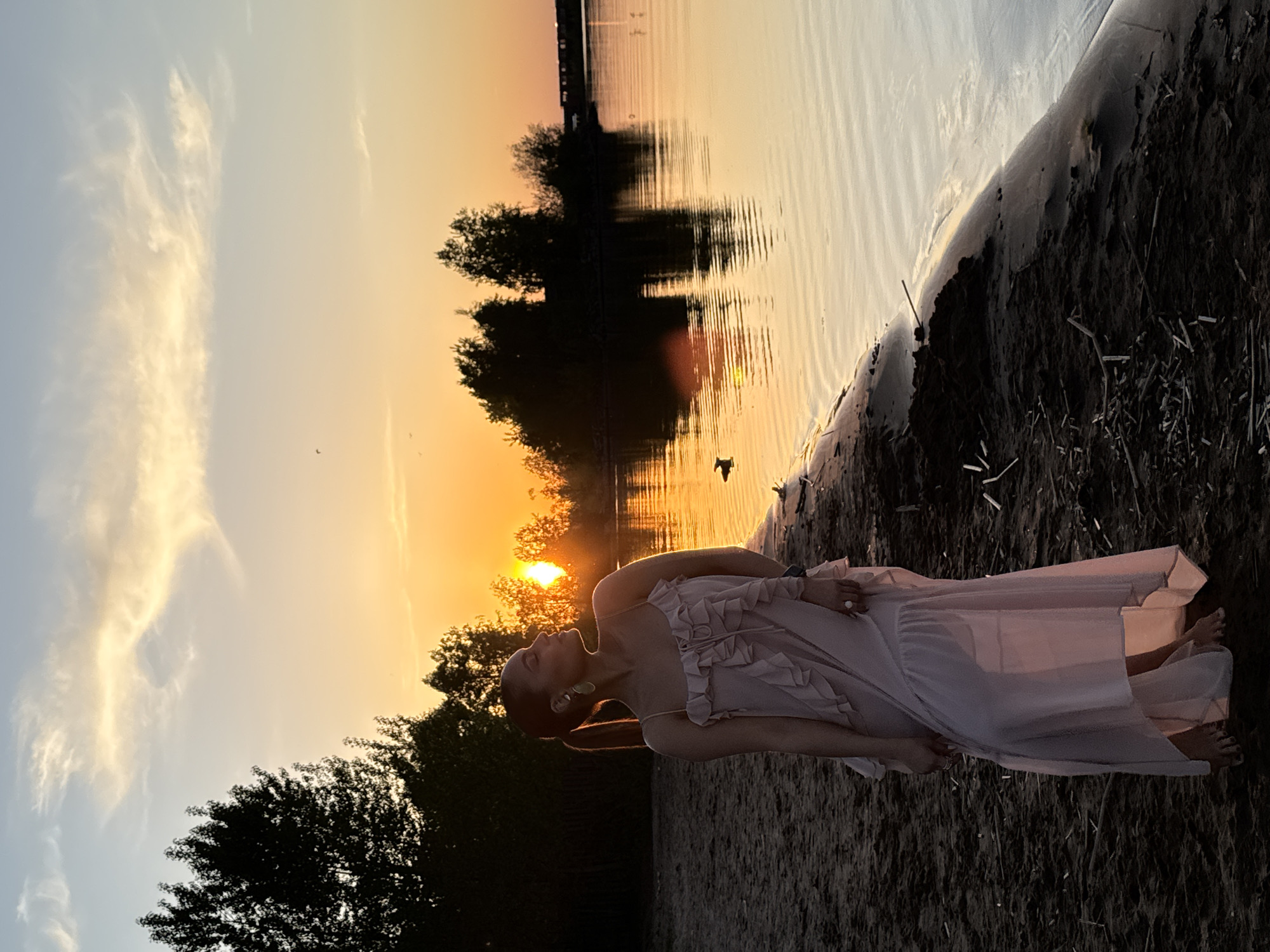Mother and child enjoy sunset beach moment in Chaikovsky