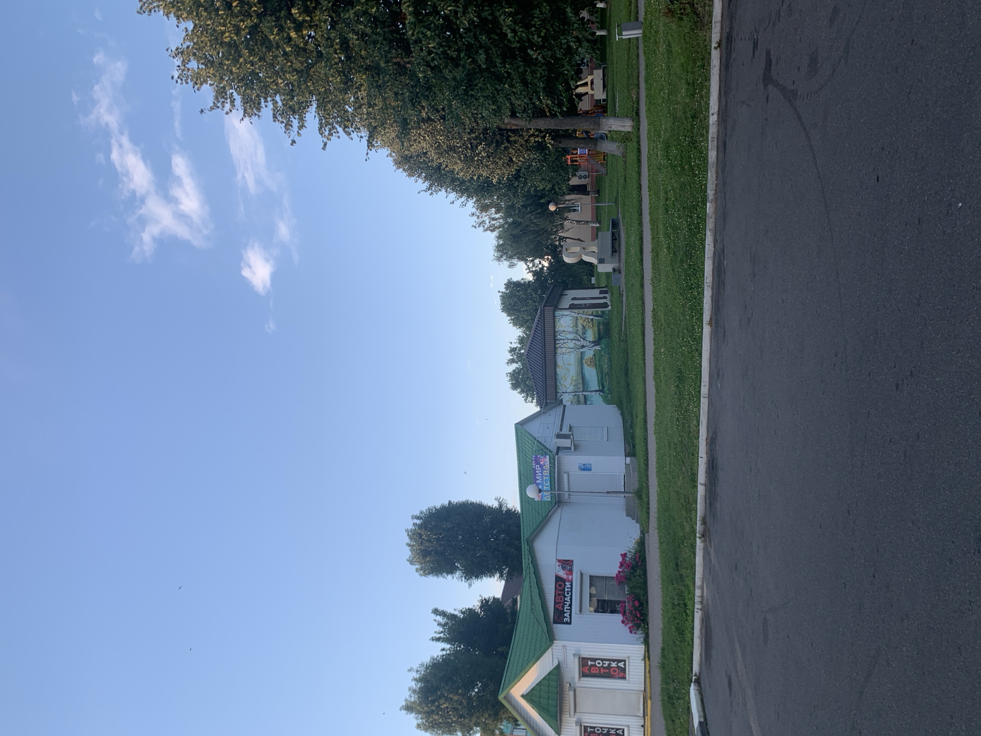 Summer evening around Kapyĺ's central square and fountain