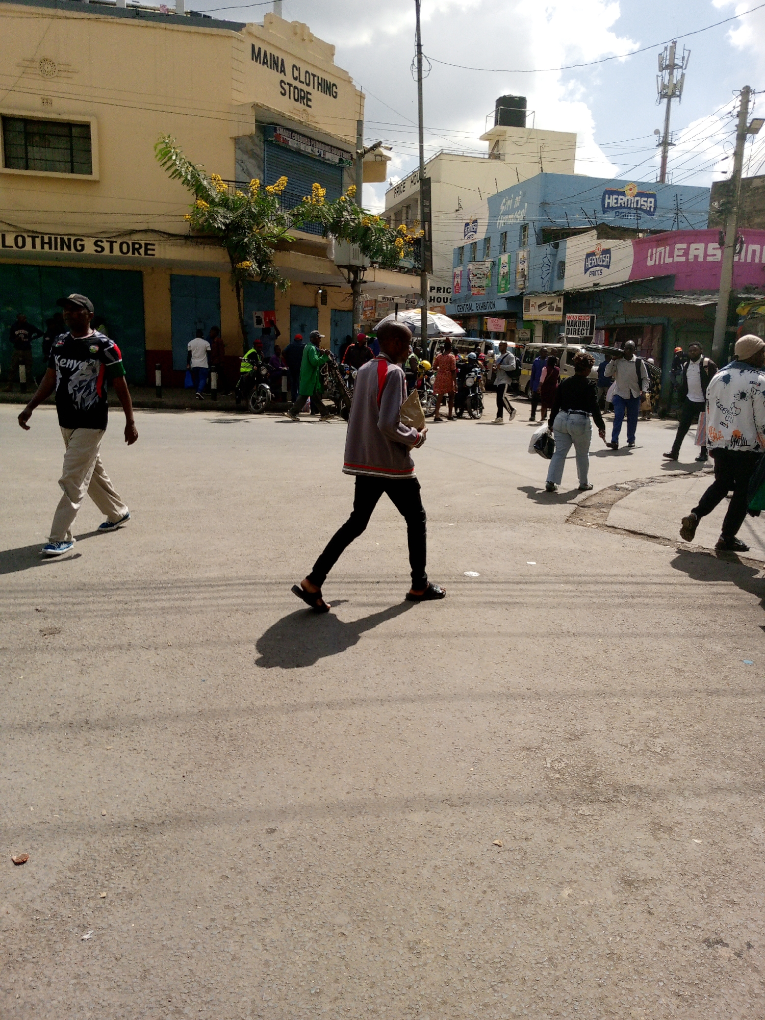 Morning pedestrian activity observed on Nairobi commercial street