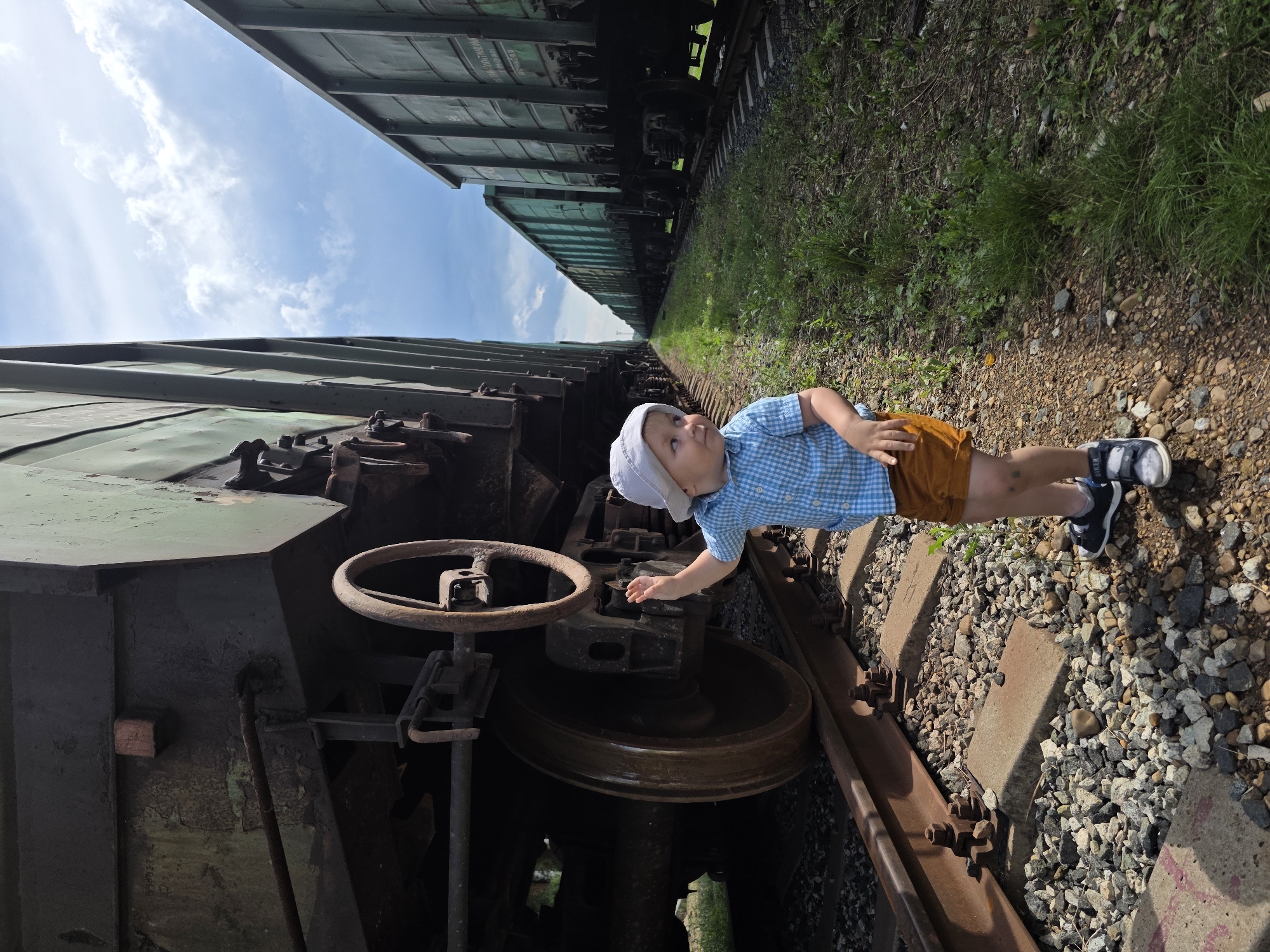 Toddler explores a freight rail yard in Chaikovsky, Russia