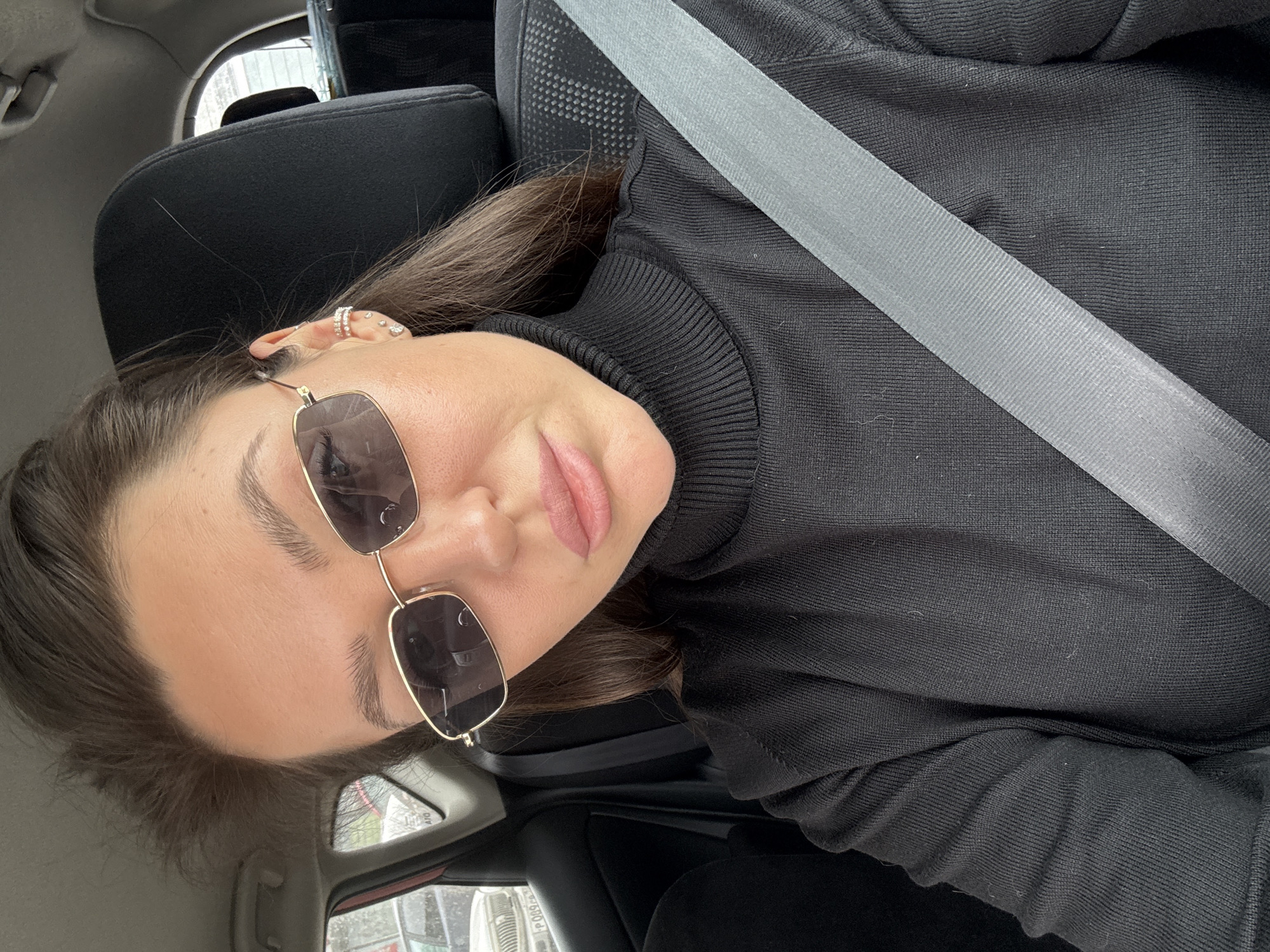 Woman in black turtleneck observed in car, Krasnoyarsk