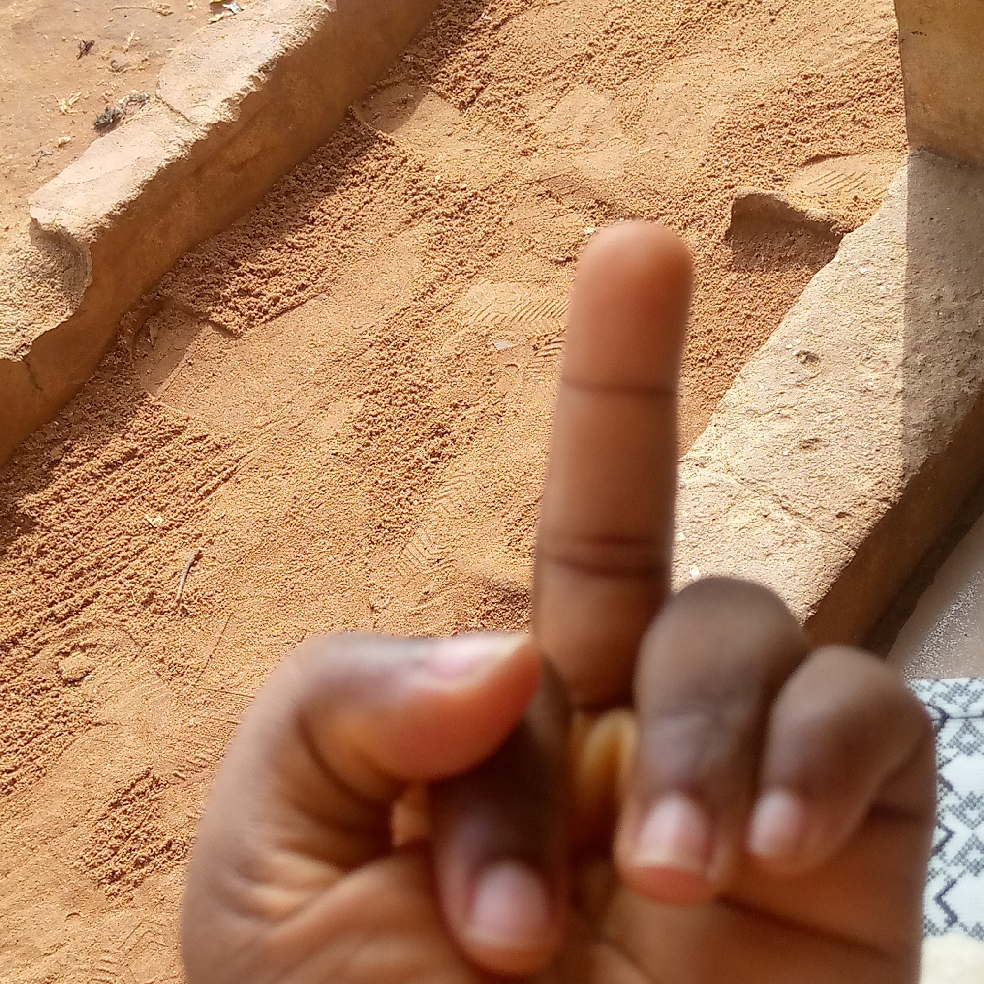 Person makes obscene gesture in Nsugbe, Nigeria