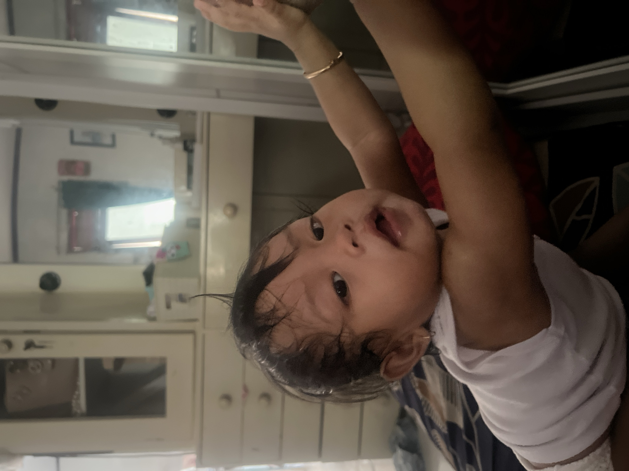 Mother and child share quiet morning moments in Pati home
