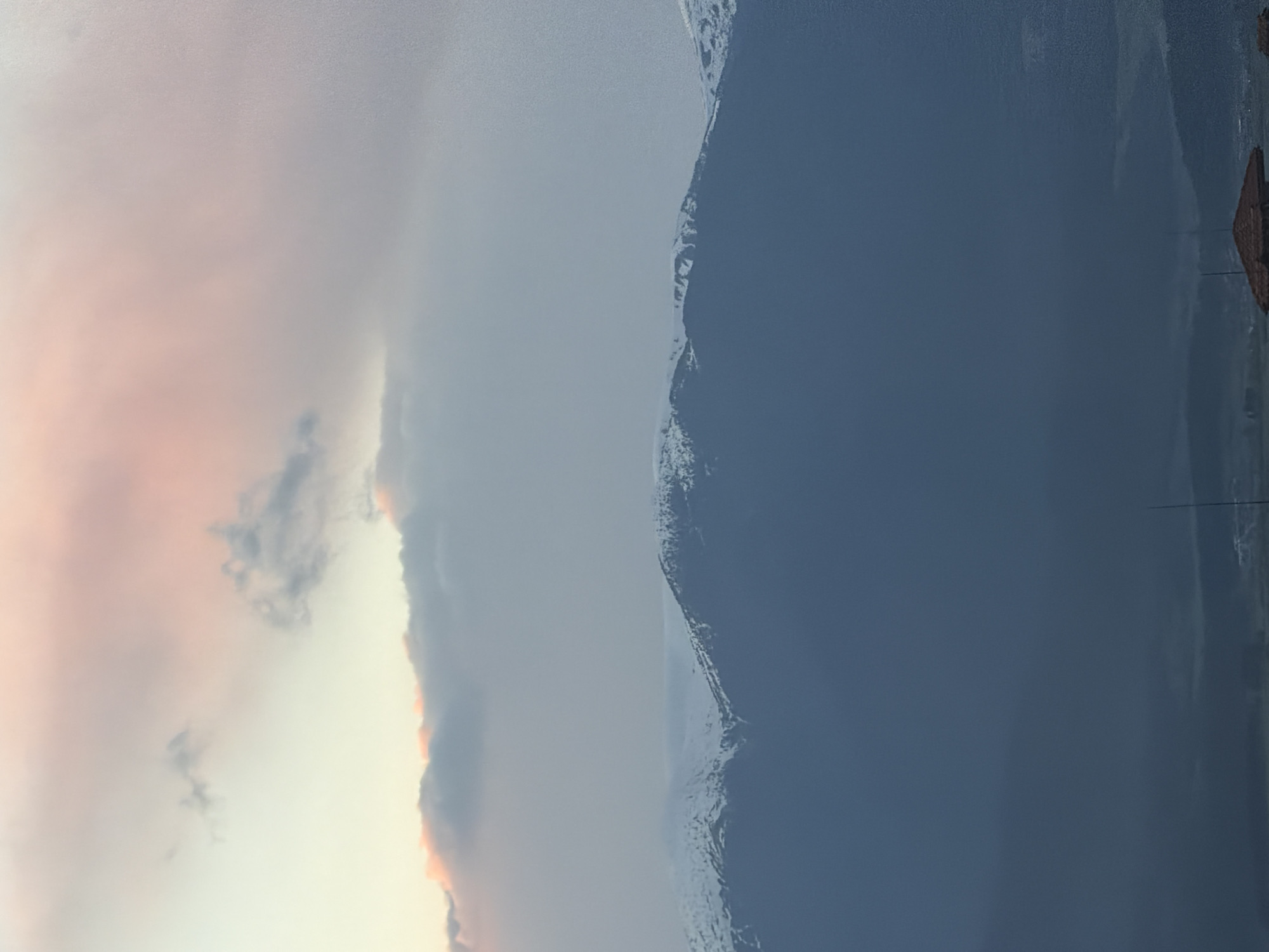 Twilight sky captured over snow-capped mountains in Bansko, Bulgaria
