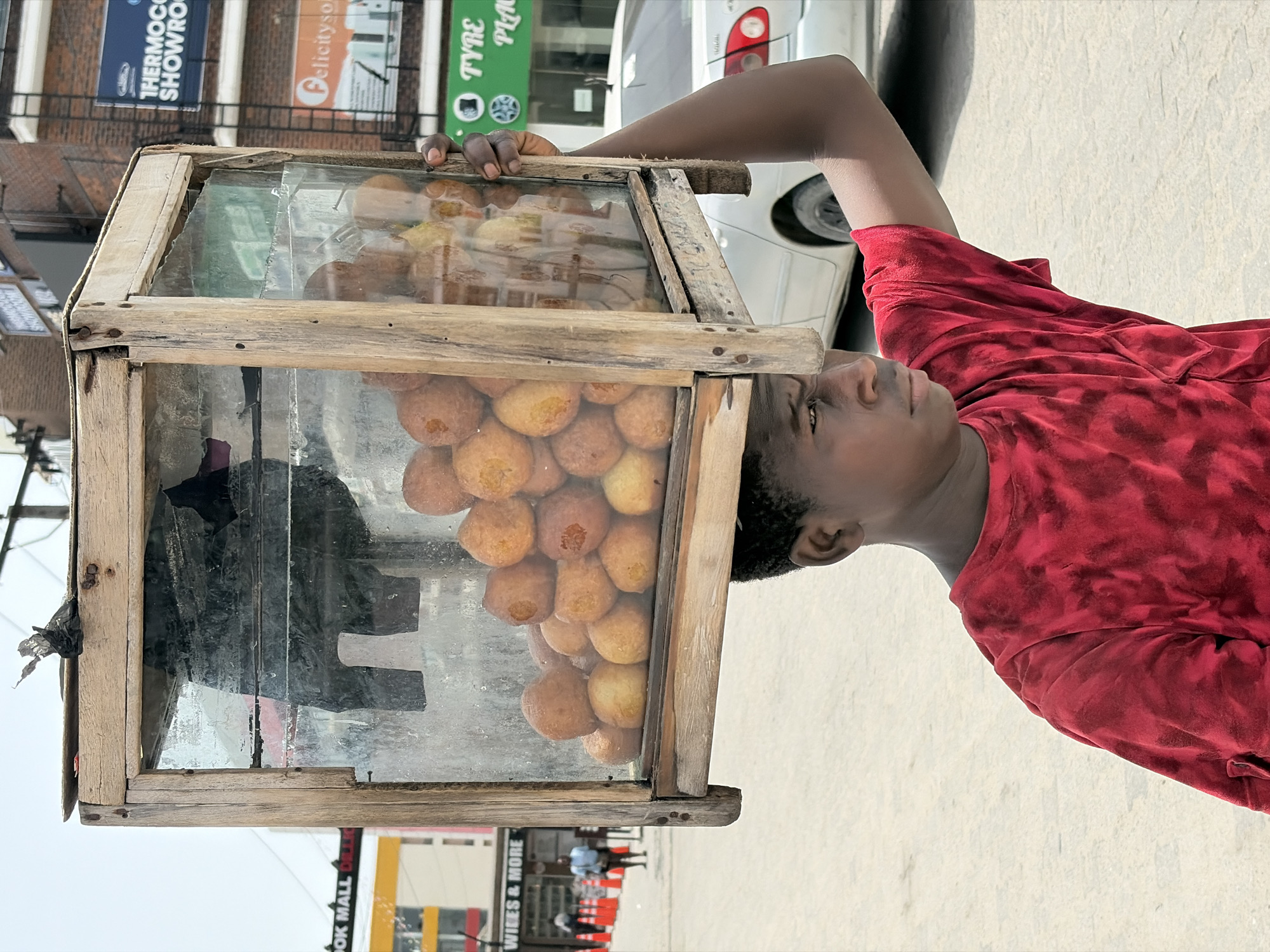 Street vendors active in Alaguntan, Nigeria morning scene