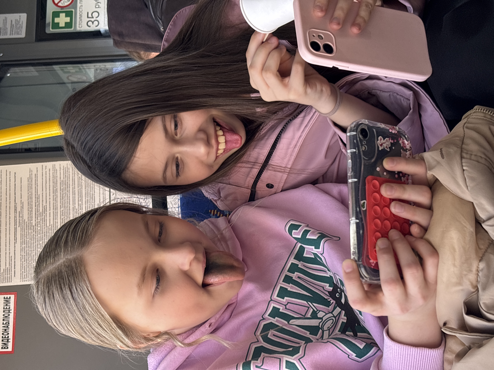 Two girls ride public transport in Izhevsk, Russia
