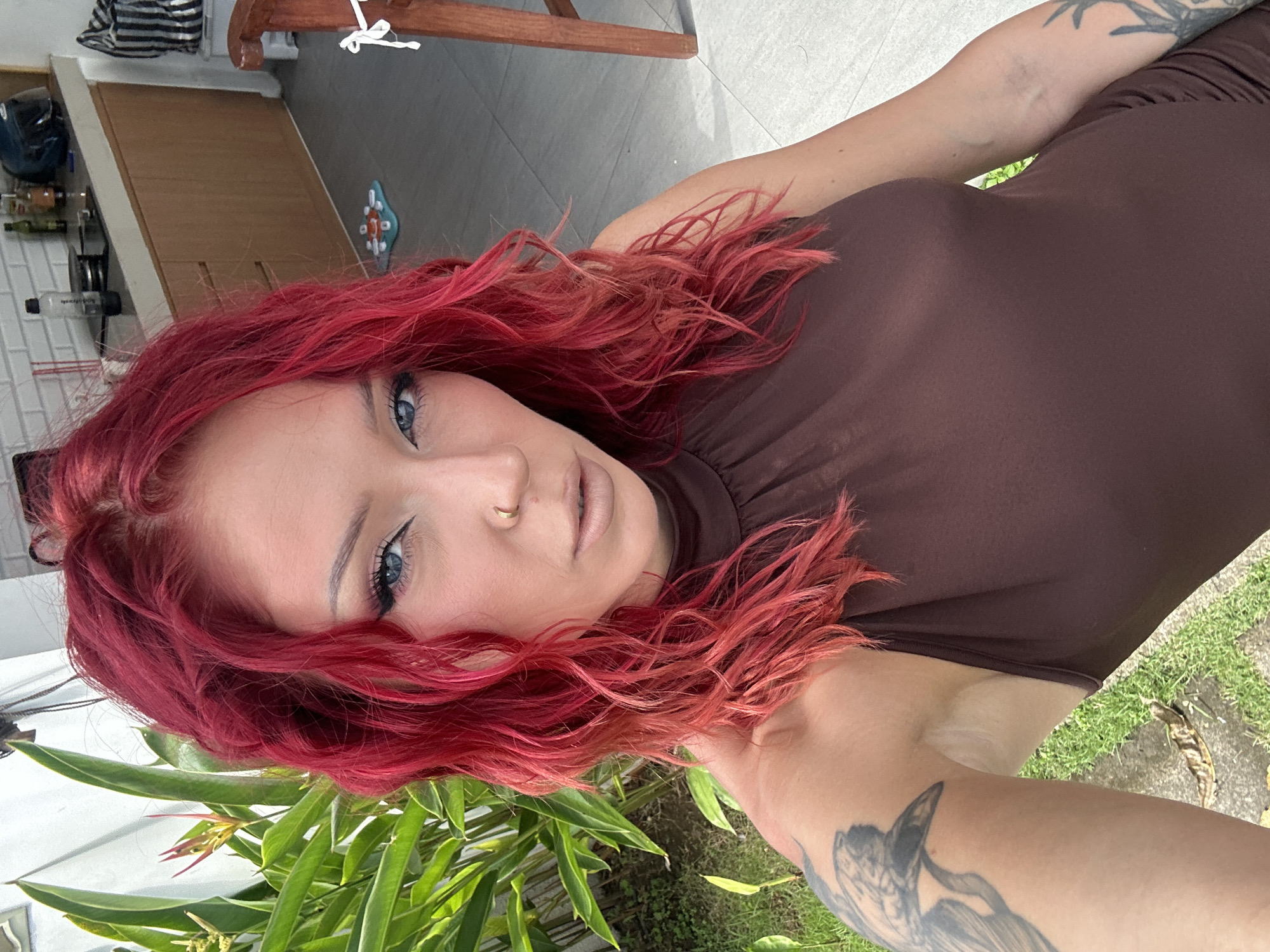 Tattooed woman observed in outdoor North Kuta setting