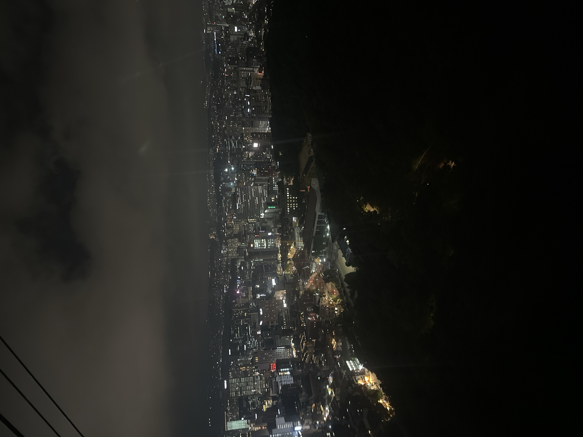 Seoul skyline captured at night with partial cloud cover