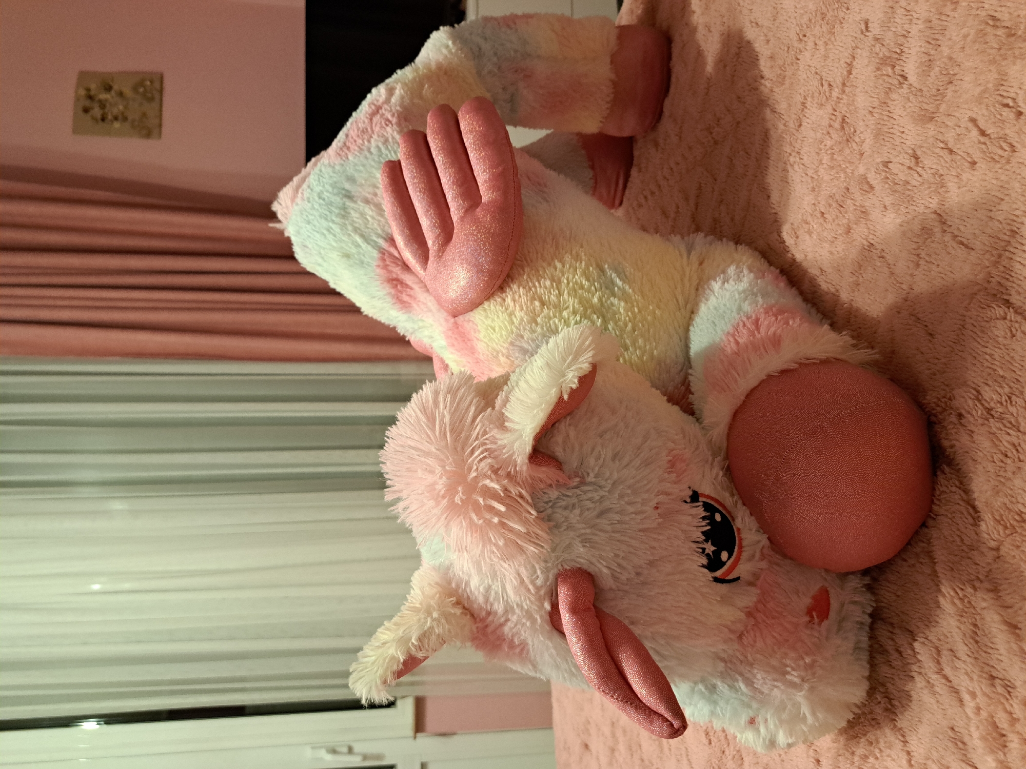 Plush unicorn toy spotted on pink blanket in Bulgaria